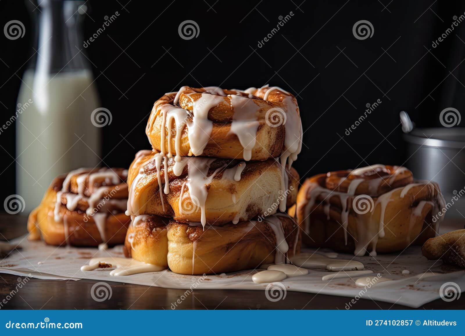 Stack of Warm, Gooey Cinnamon Buns with Drizzle of Icing Stock
