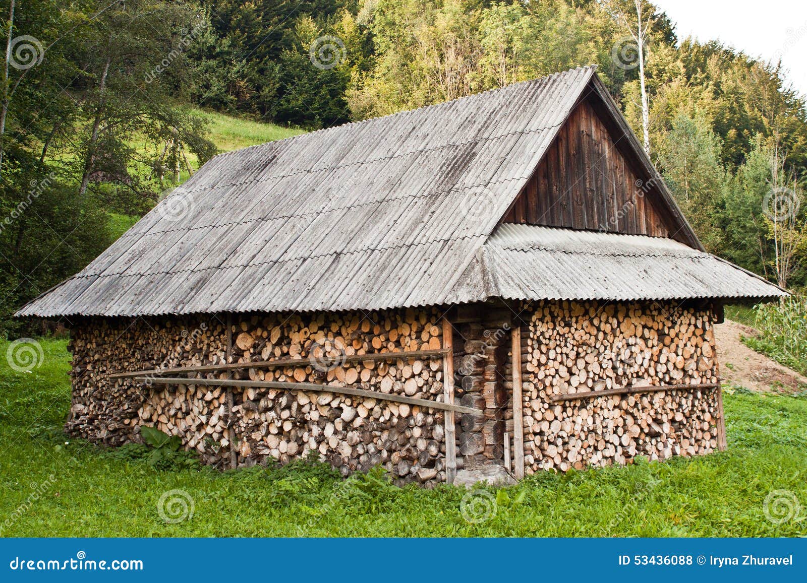 Stack of Wood Near the House. Stock Photo Image of outside, chopped 53436088