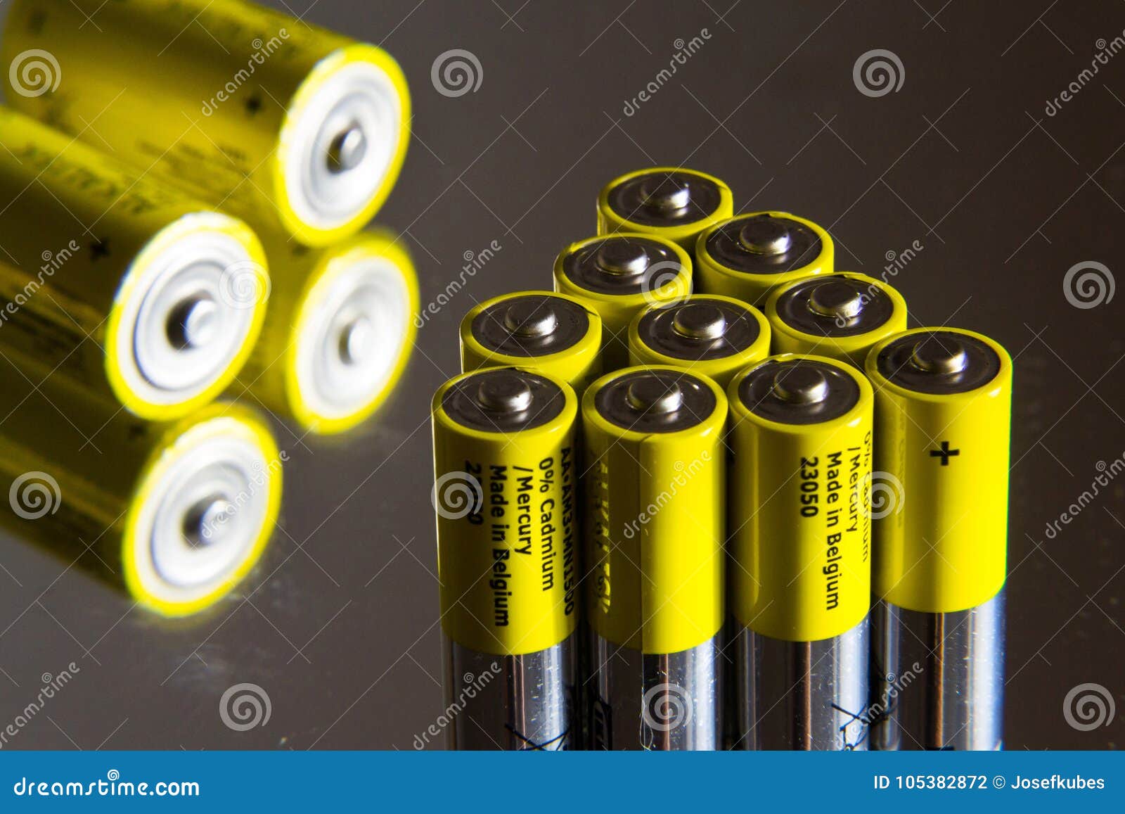 Stack of Yellow AA Batteries Close Up, Electricity Storage Concept