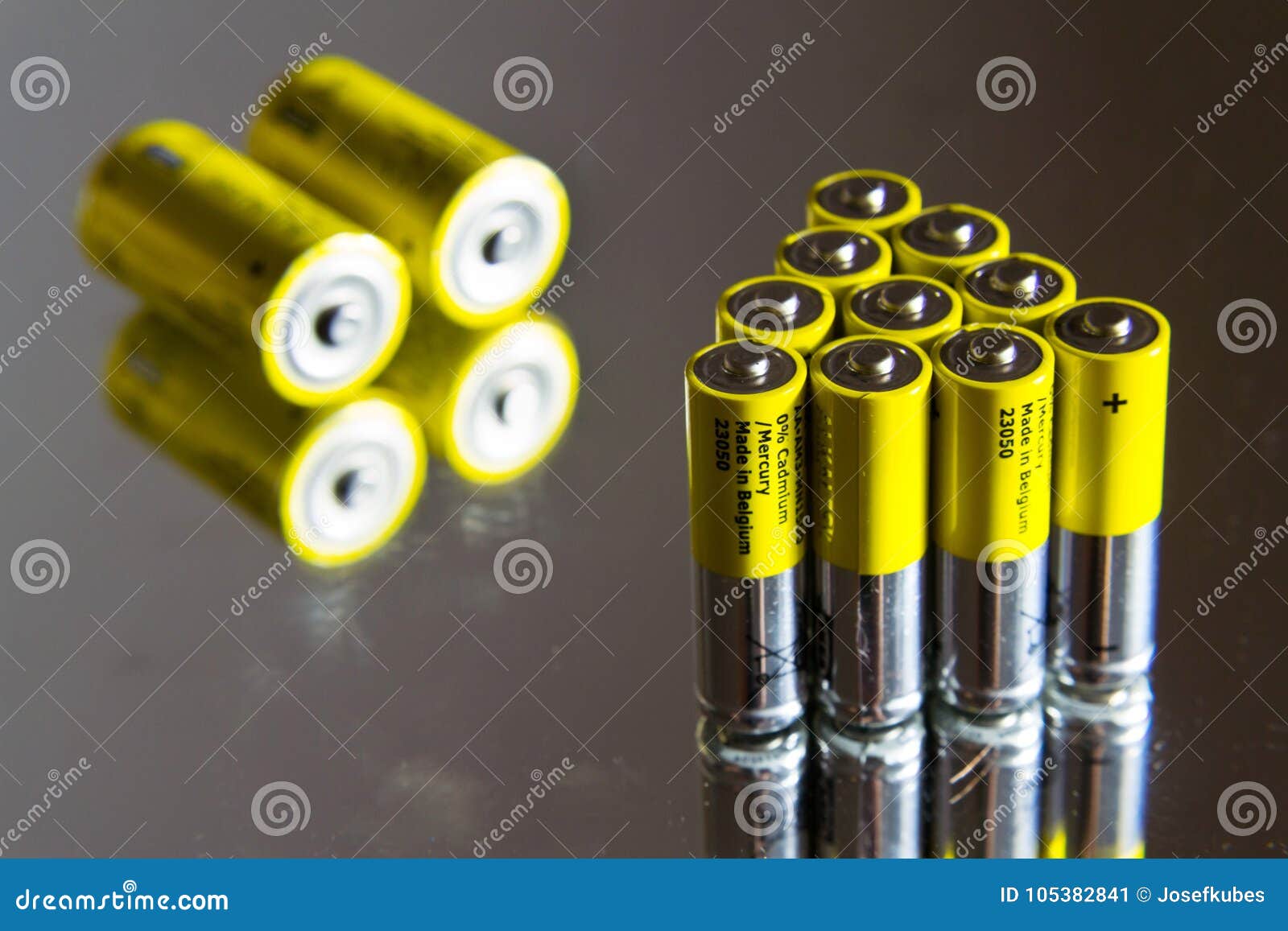 Stack of Yellow AA Batteries Close Up, Electricity Storage Concept
