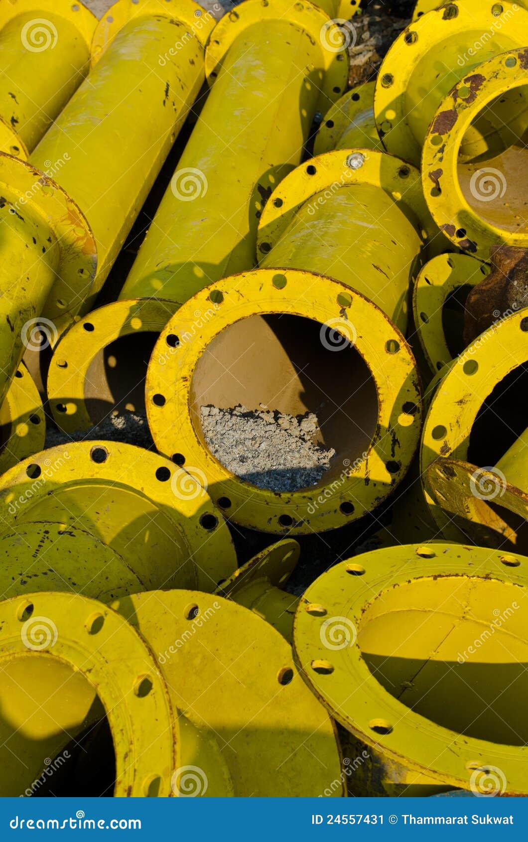Stack of yellow steel pipe stock image. Image of maintenance 24557431