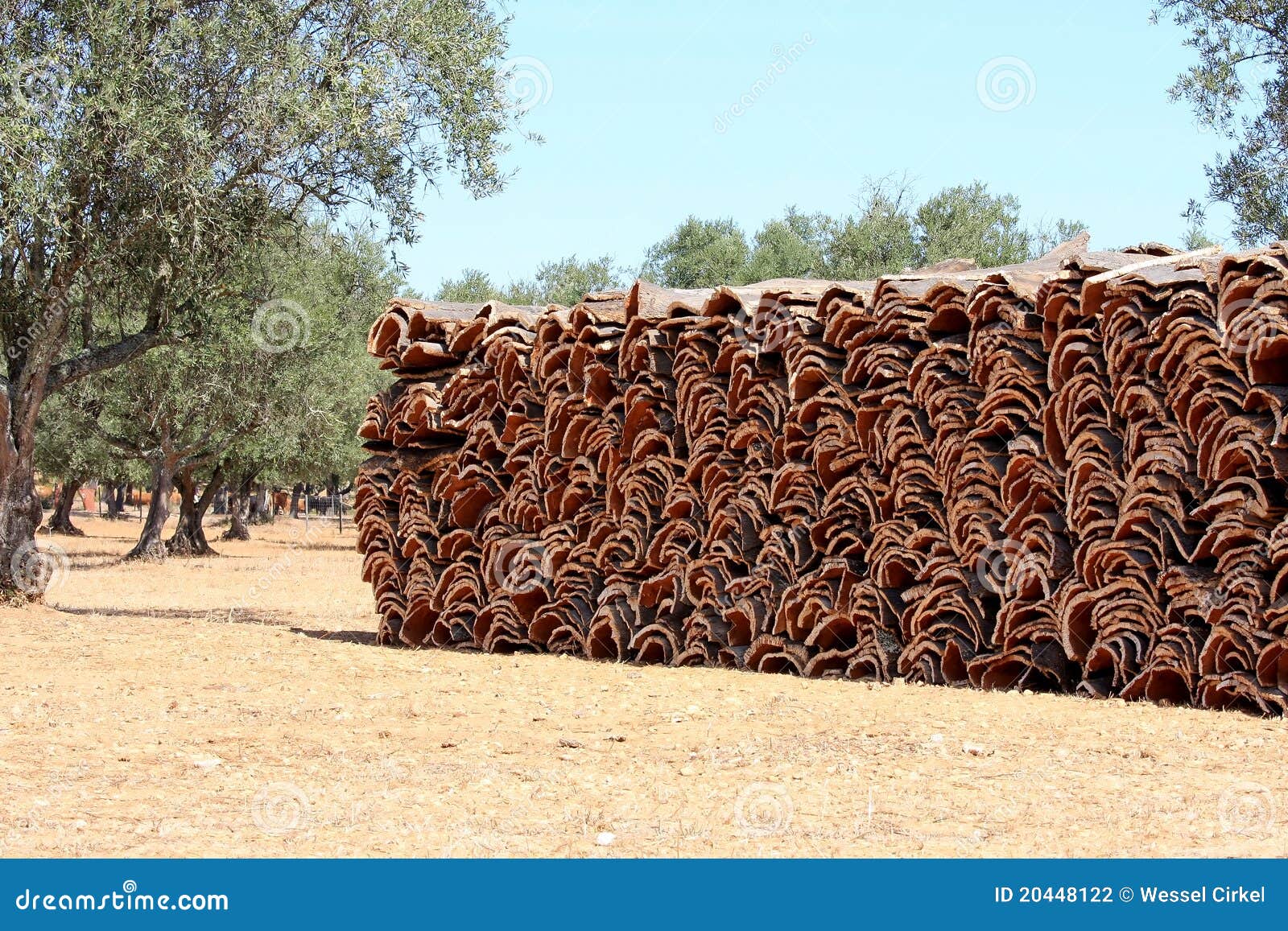 stacked bark of the cork oak in alentejo, portugal