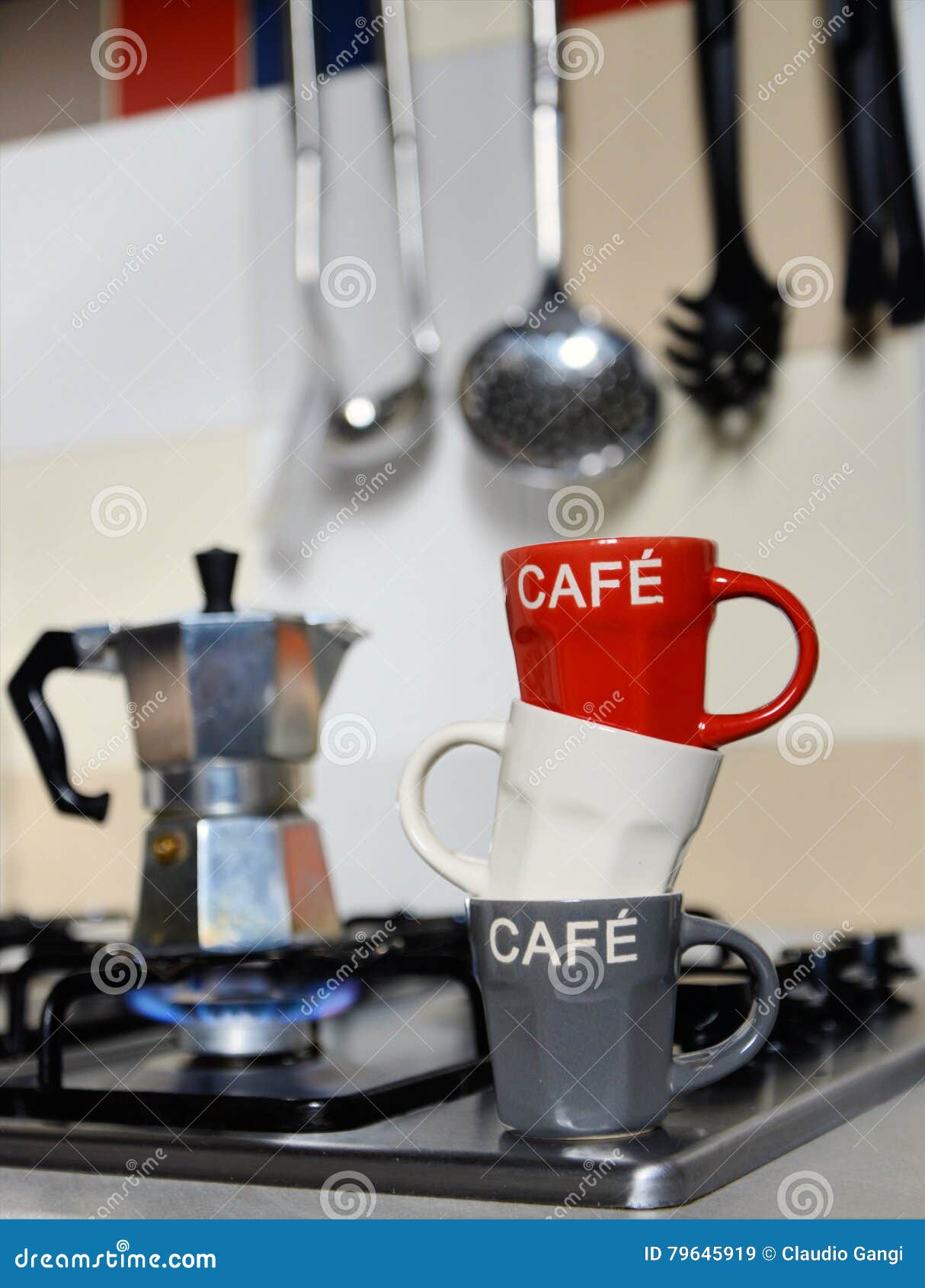 Stacked Coffee Cup and Vintage Coffeepot on Kitchen Stove Stock Image