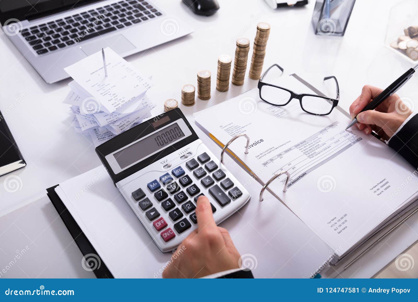 businesswoman calculating invoice