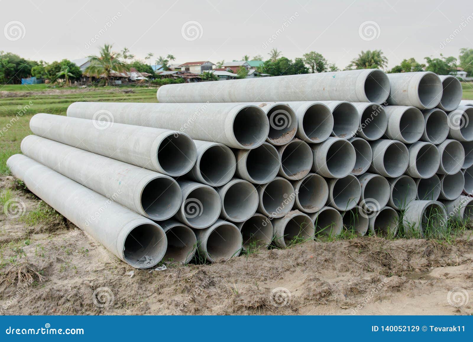Stacked of Concrete, Cement Pipes. Concrete Pipes for Irrigation at