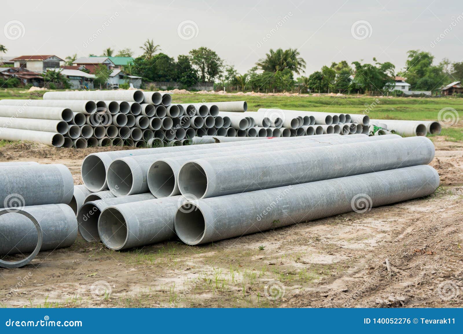 Stacked of Concrete, Cement Pipes. Concrete Pipes for Irrigation at