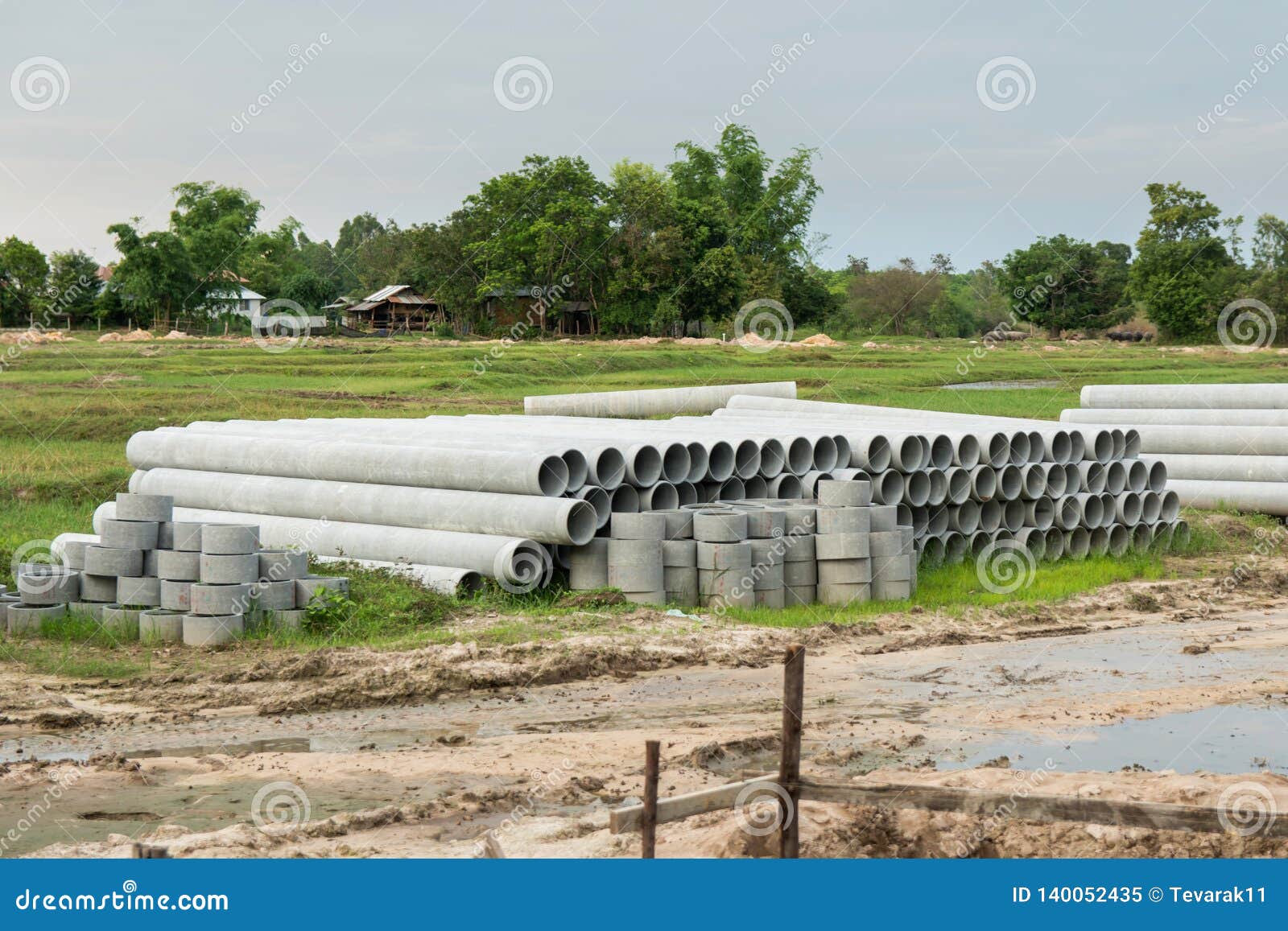 Stacked of Concrete, Cement Pipes. Concrete Pipes for Irrigation at