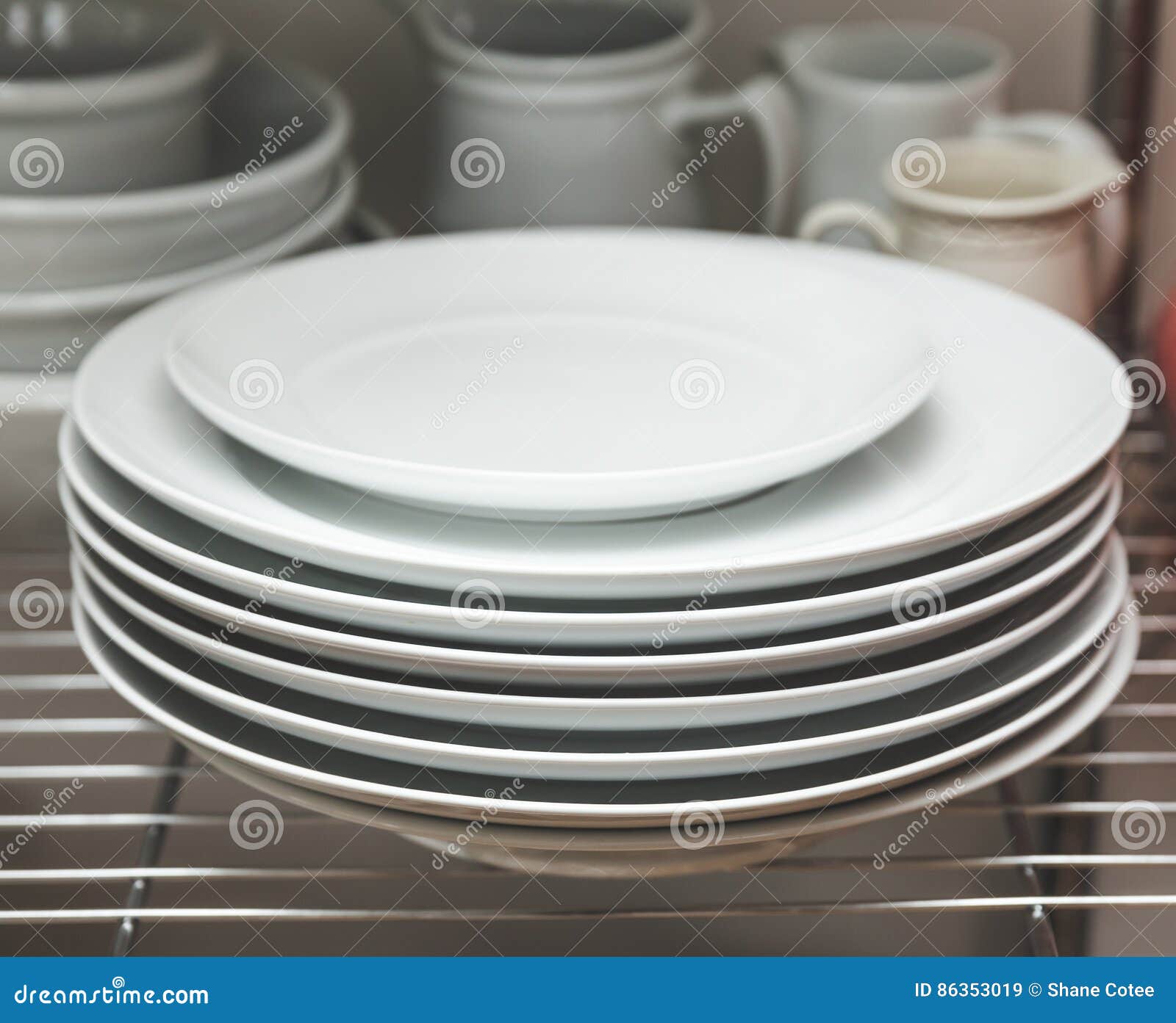 Stacked dishes in kitchen stock image. Image of cups 86353019
