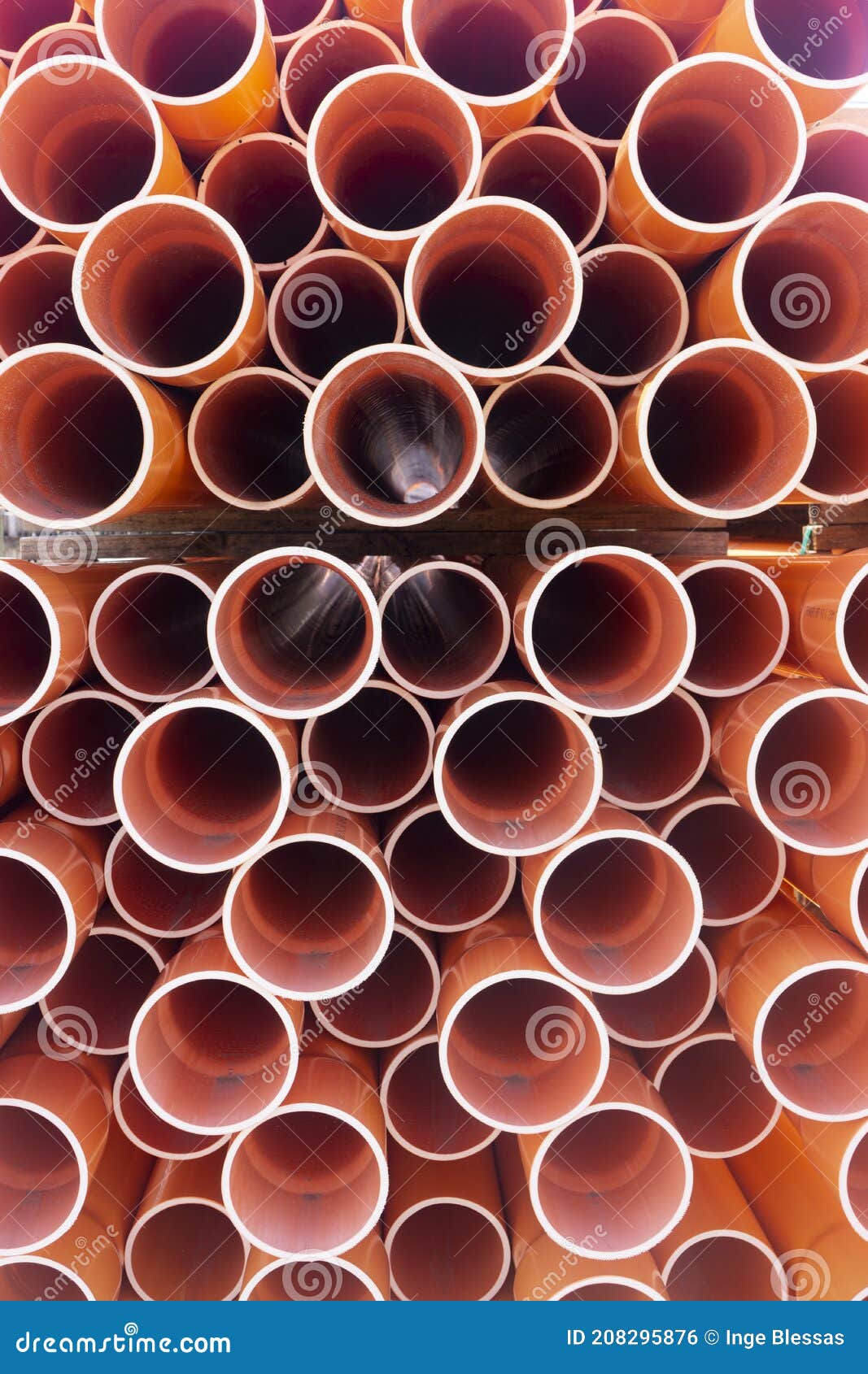 Stacked Orange Electrical Conduit Pipes End on Stock Photo Image of