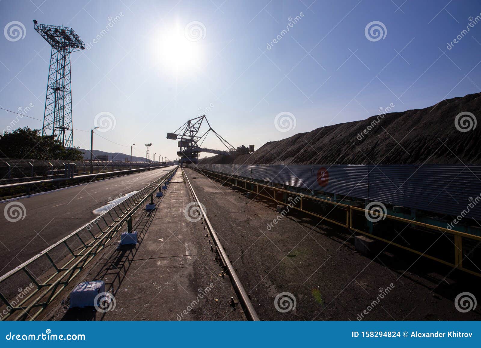 Stackerreclaimer during Loading and Unloading of Coal. Coal Heaps at a