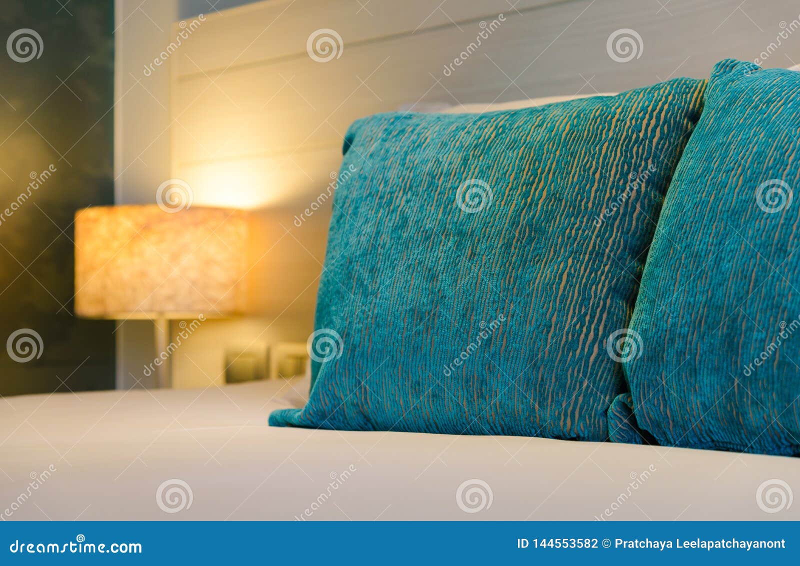 White Bed Sheets with Light Lamp Decoration Interior of Bedroom