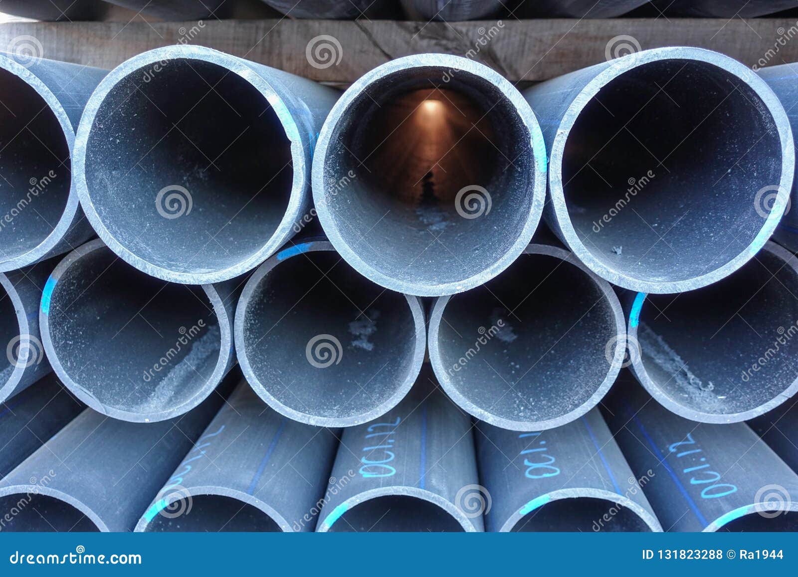 Stacks of Black Plastic Pipes. Round Ends Close Up Stock Photo Image
