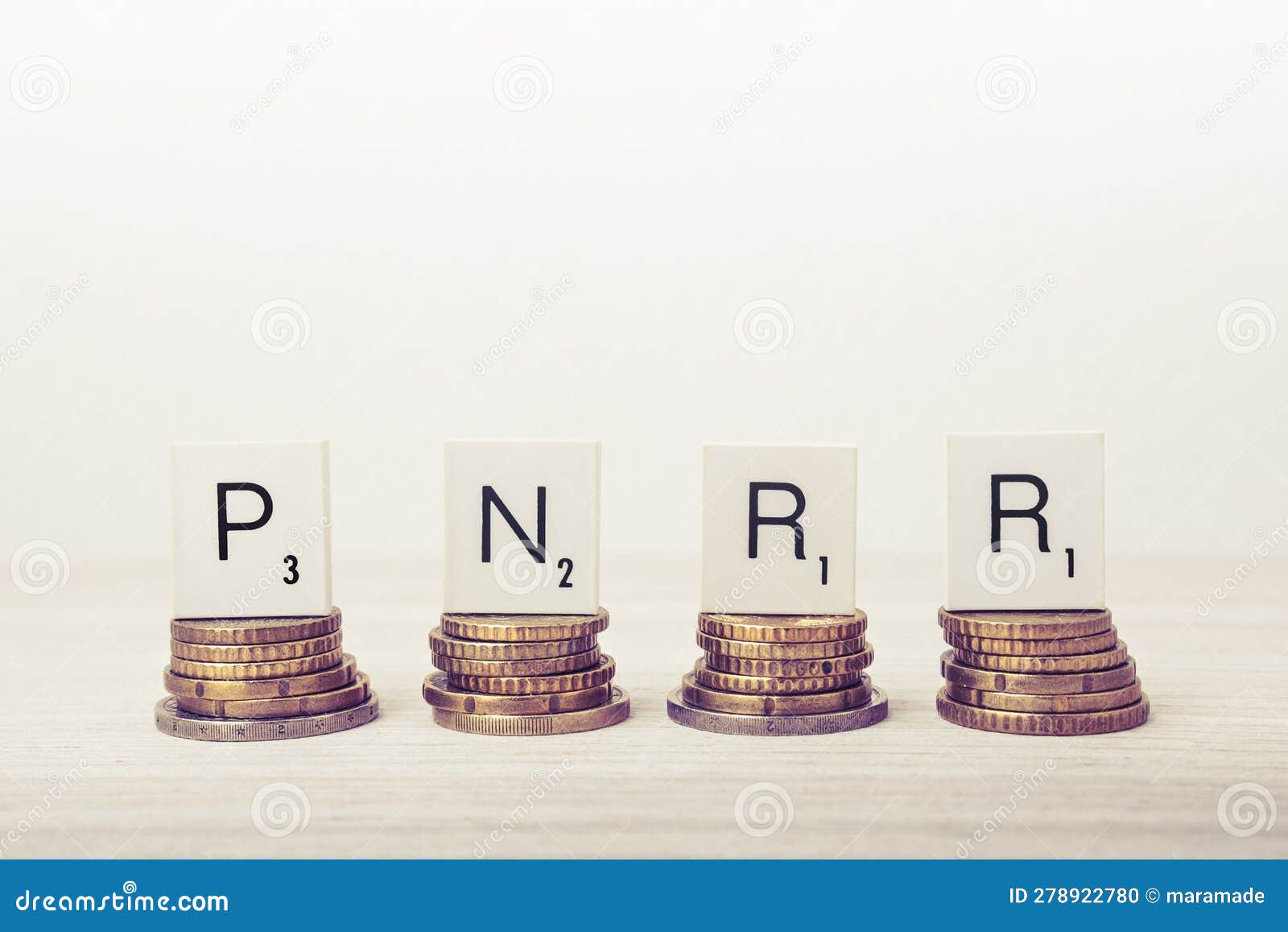 stacks of coins with pnrr letters. ue economy concept.
