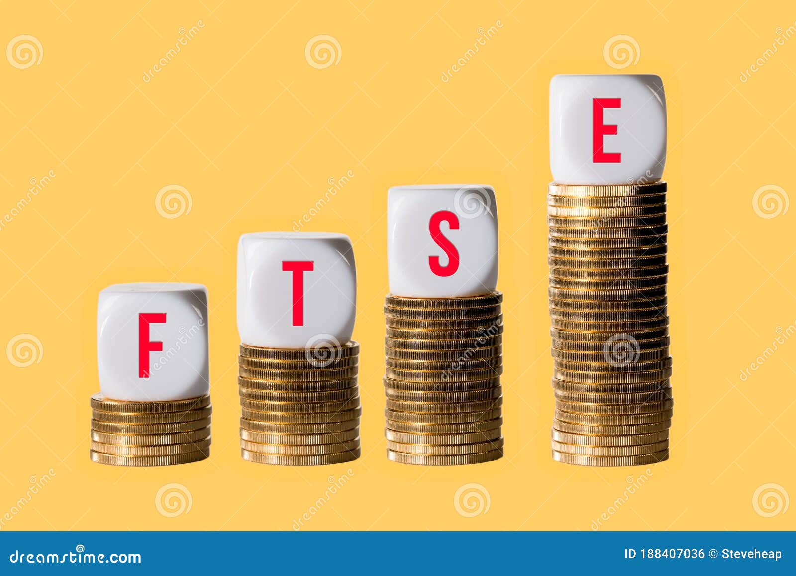 stacks of gold coins with cubes spelling ftse to show rise in value of the index in london
