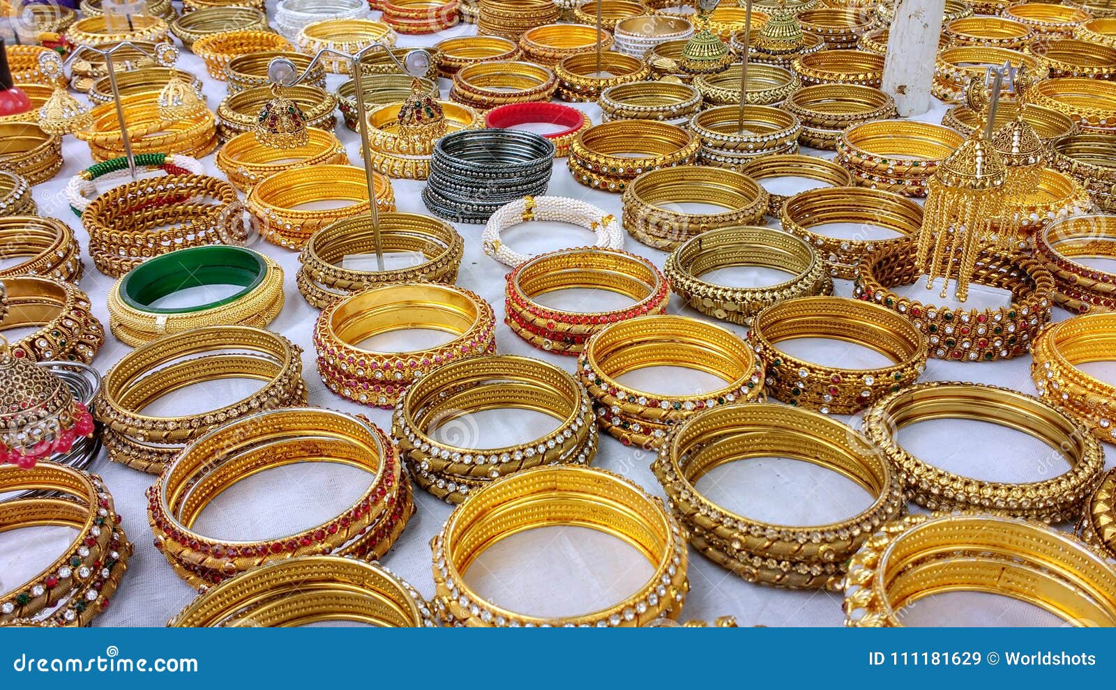 Display of Gold Bracelets for Sale on White Cloth Stock Image Image