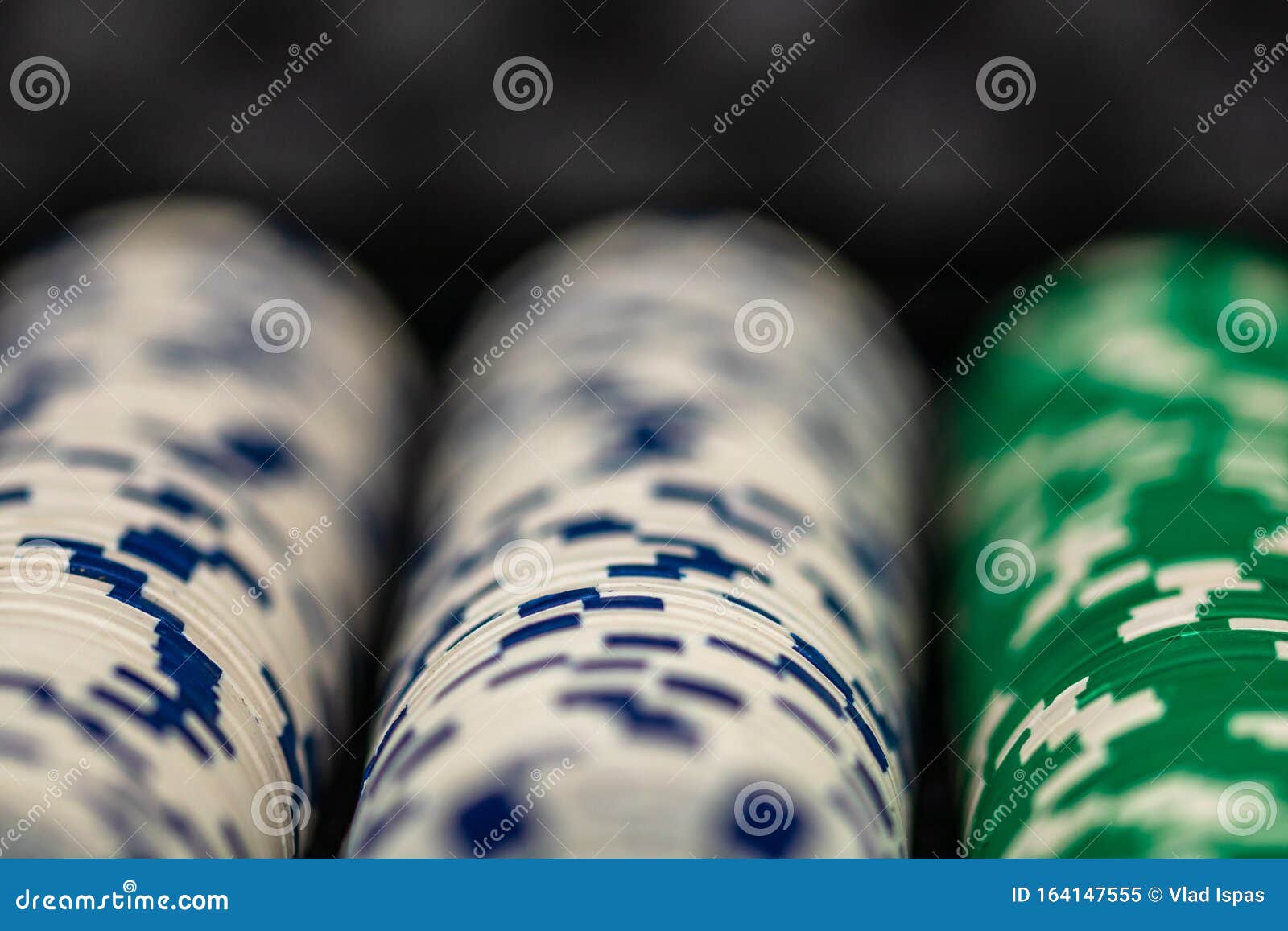 Stacks Of Poker Chips Stand On A Deck Of Playing Cards Next To Red