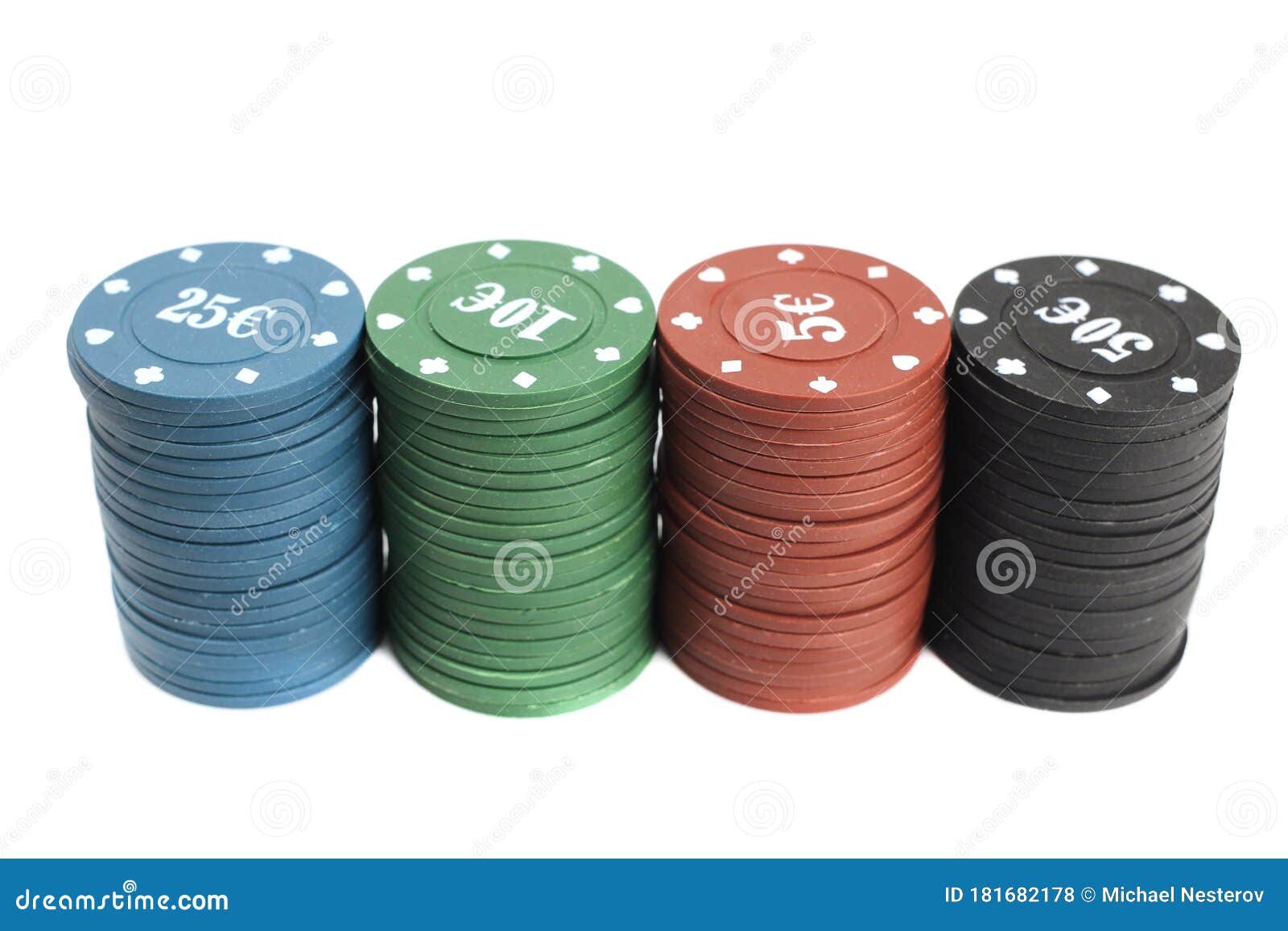Stacks of Poker Chips of Four Denominations are Isolated on a White