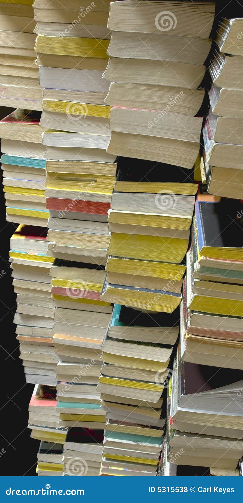 stacks of used paperback books