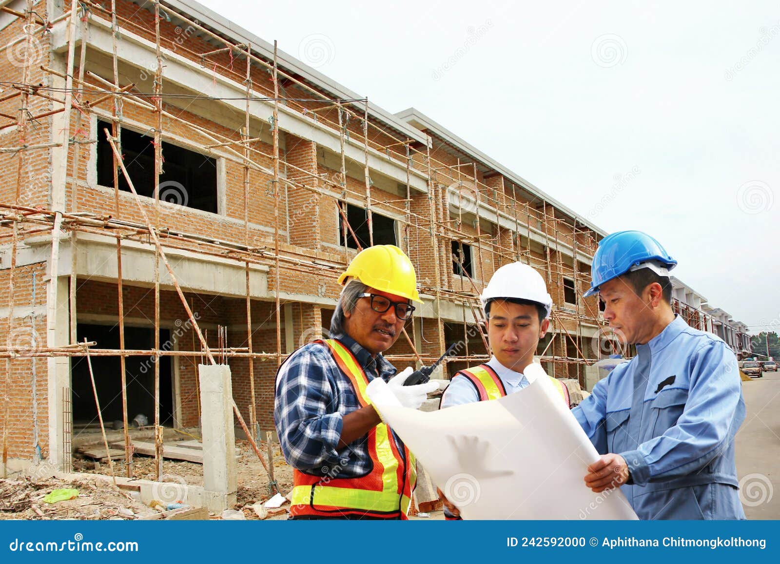 Staff Engineers are Brainstorming Solutions between Working in Construction Site Stock Photo