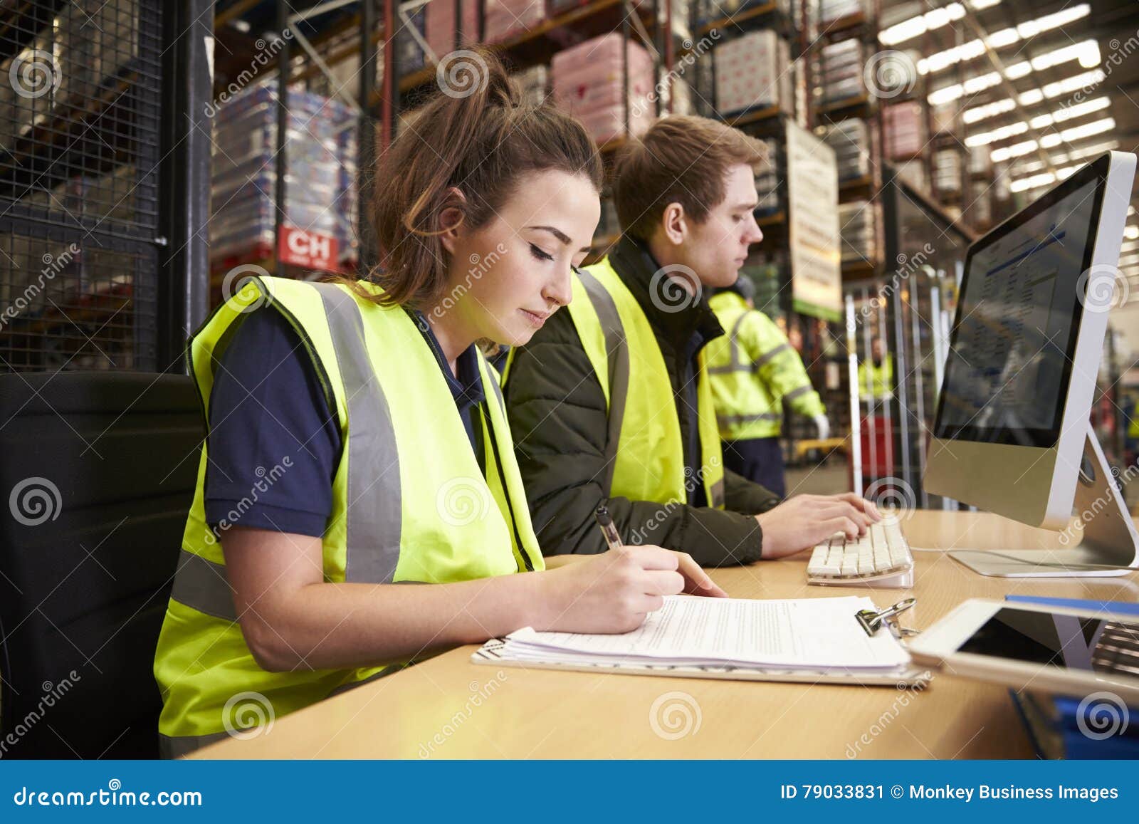 staff managing warehouse logistics in an on-site office