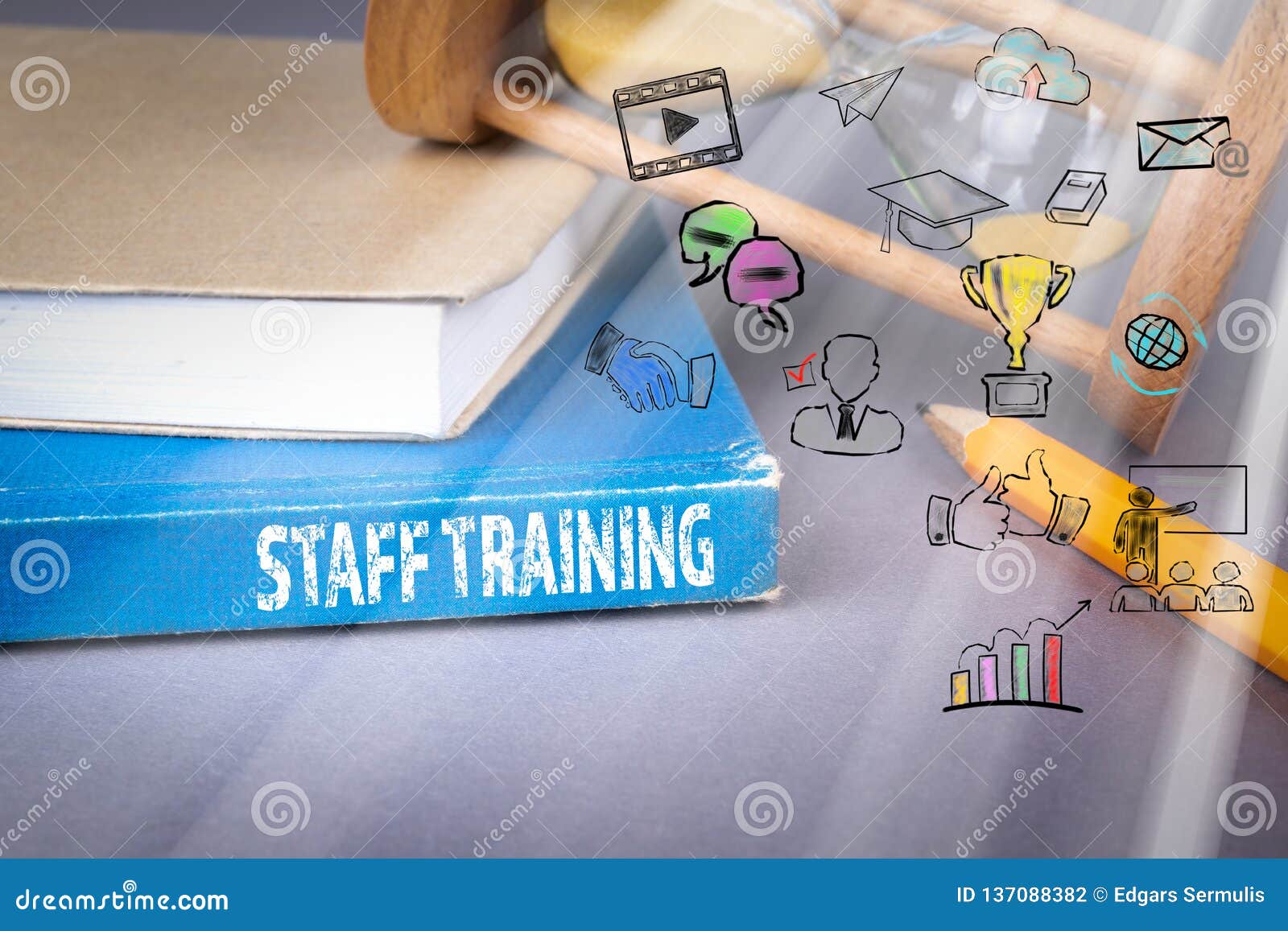 Staff Training Concept. Blue Book on a Gray Office Table Stock Photo