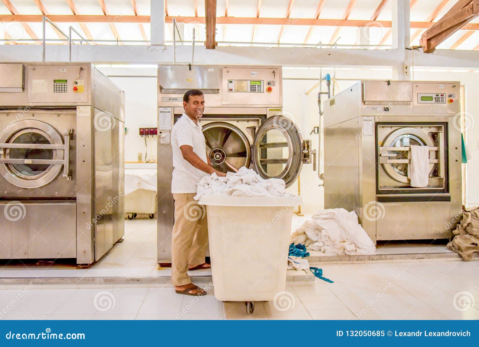 Staff in Uniform Cleaning Bed Sheets in Washing Machine Editorial Image -  Image of beautiful, cleaning: 132050685