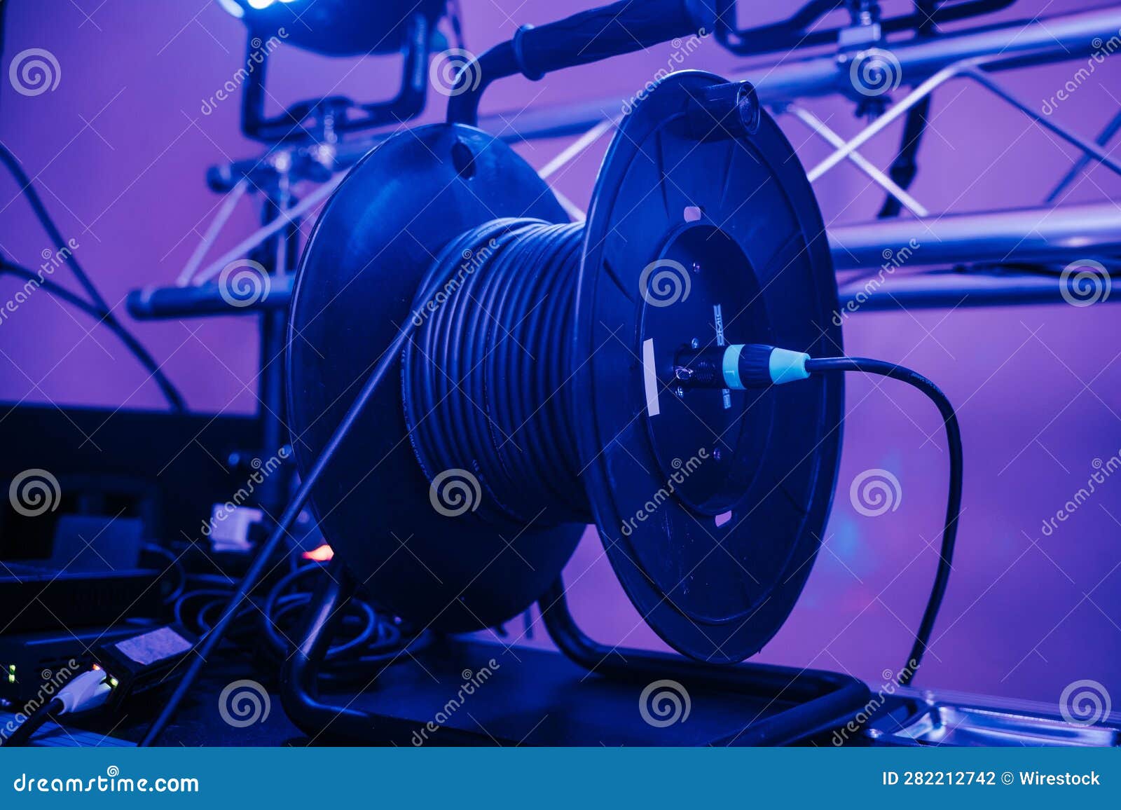 Stage Cable Reel on a Table Holding a Large Speaker Stock Photo Image