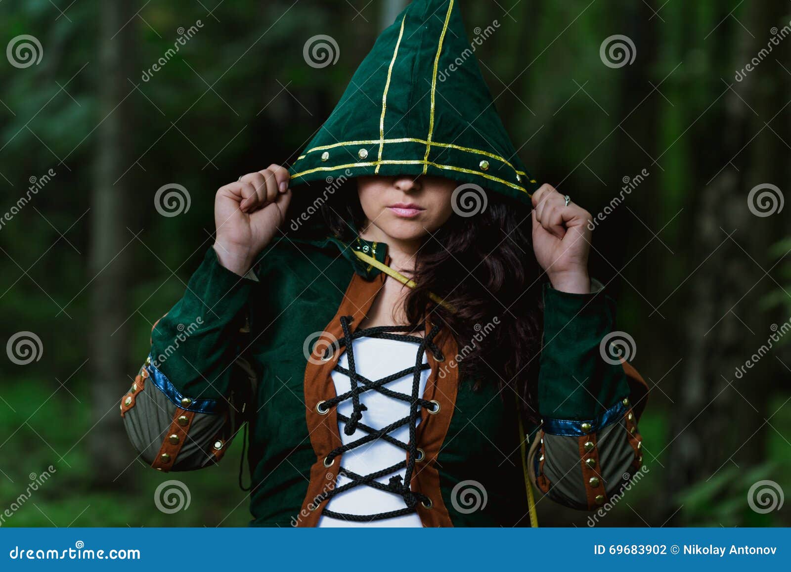 staging photo of beautiful woman in fantasy suit with hood