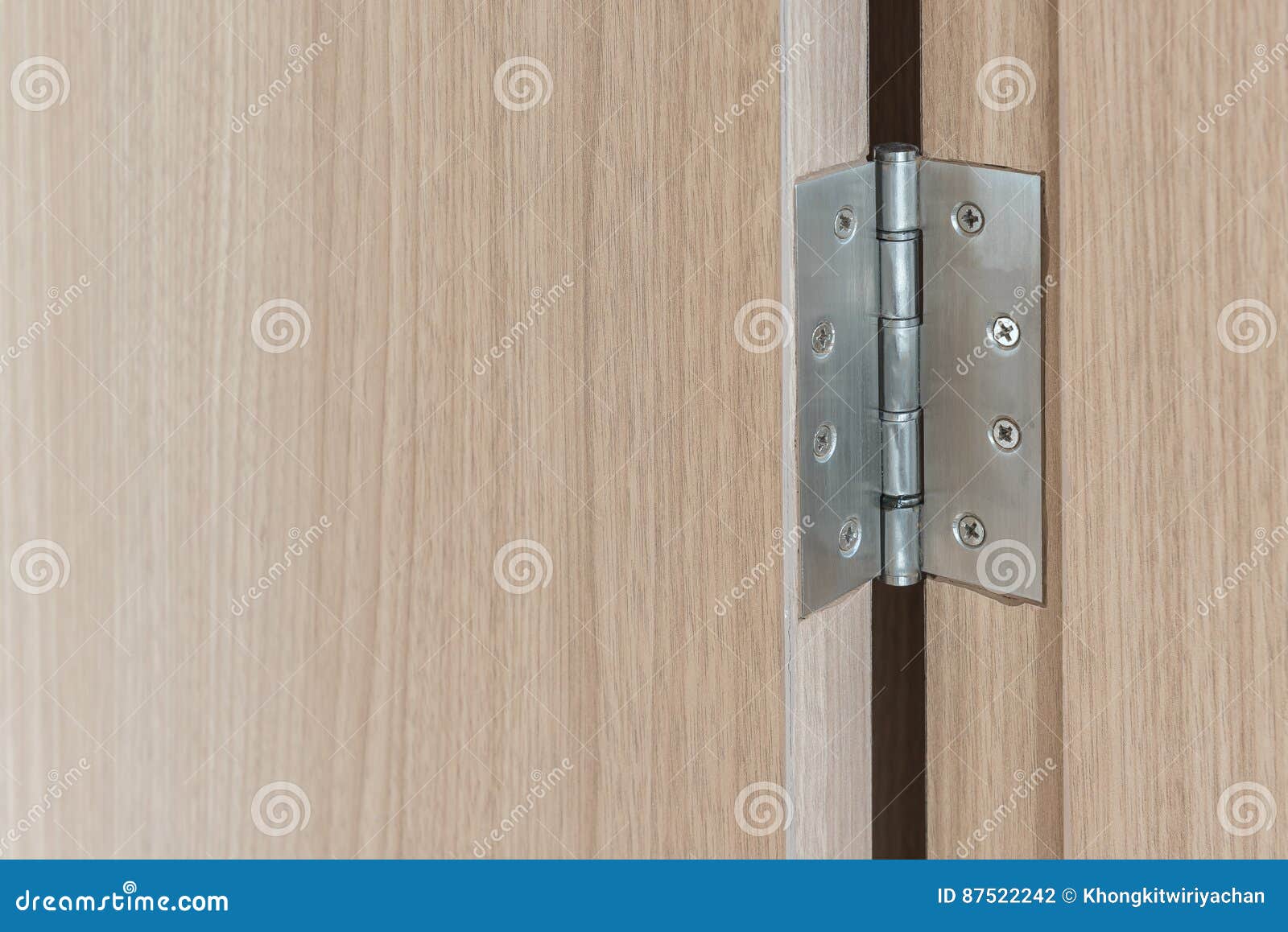 Stainless Door Hinges On Wooden Swing Door Stock Photo