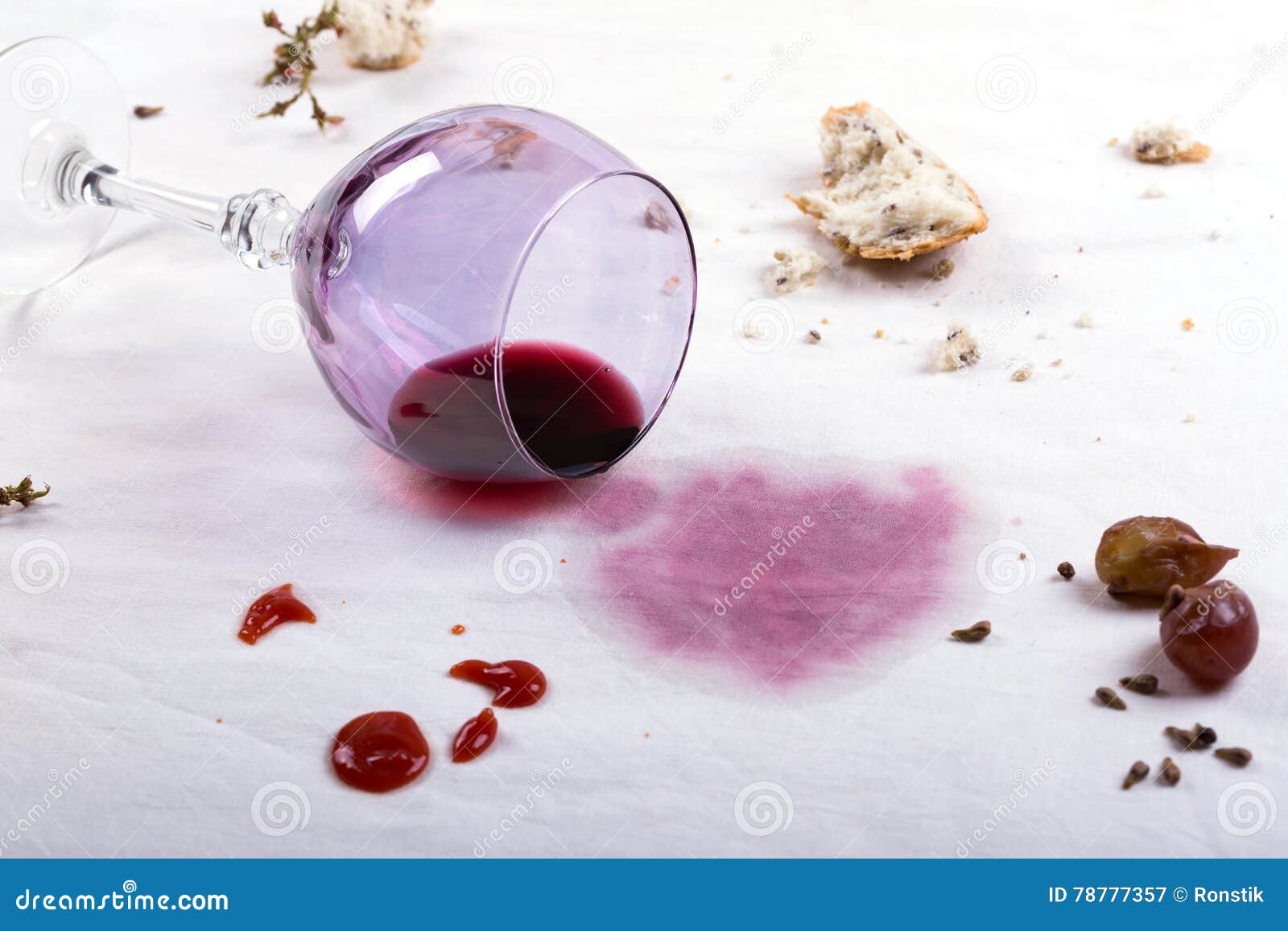 stains on tablecloth of spilled wine glass and food