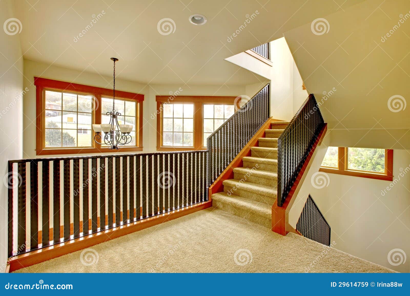 staircase with metal railing. new luxury home interior.