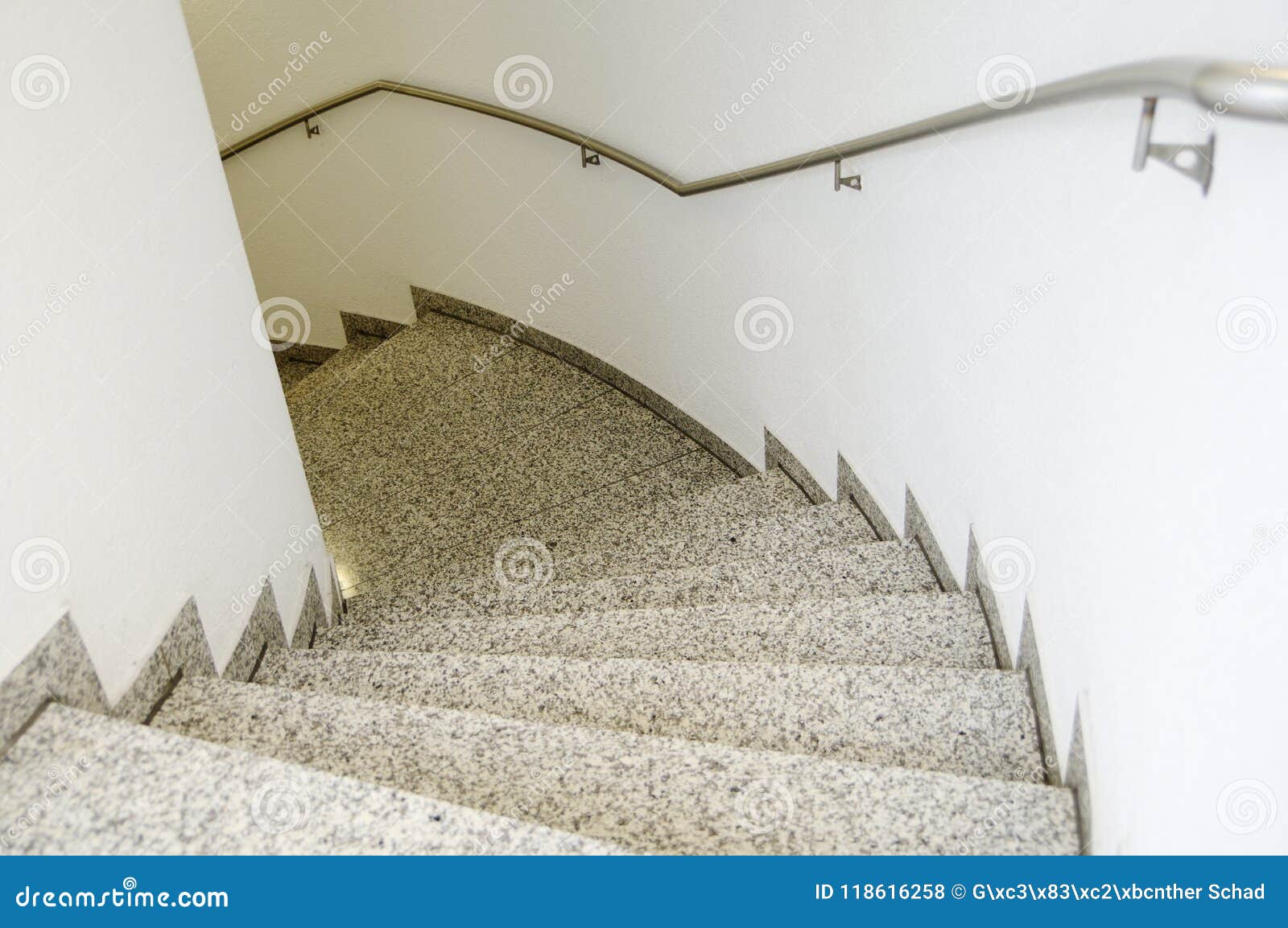 Staircase With Natural Stone And Stainless Steel Railing