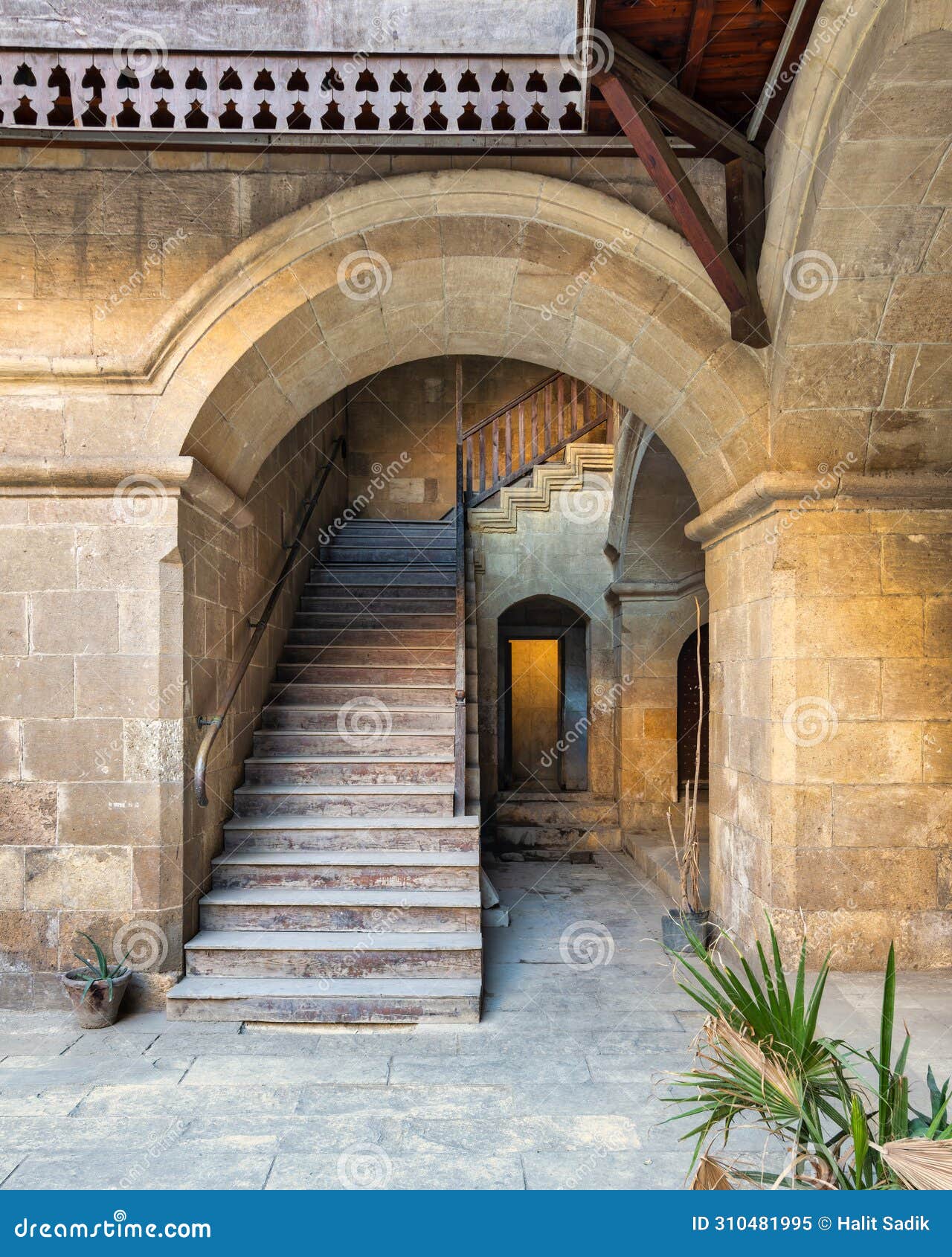 staircase with wooden balustrade leading to an old abandoned historic building, cairo, egypt