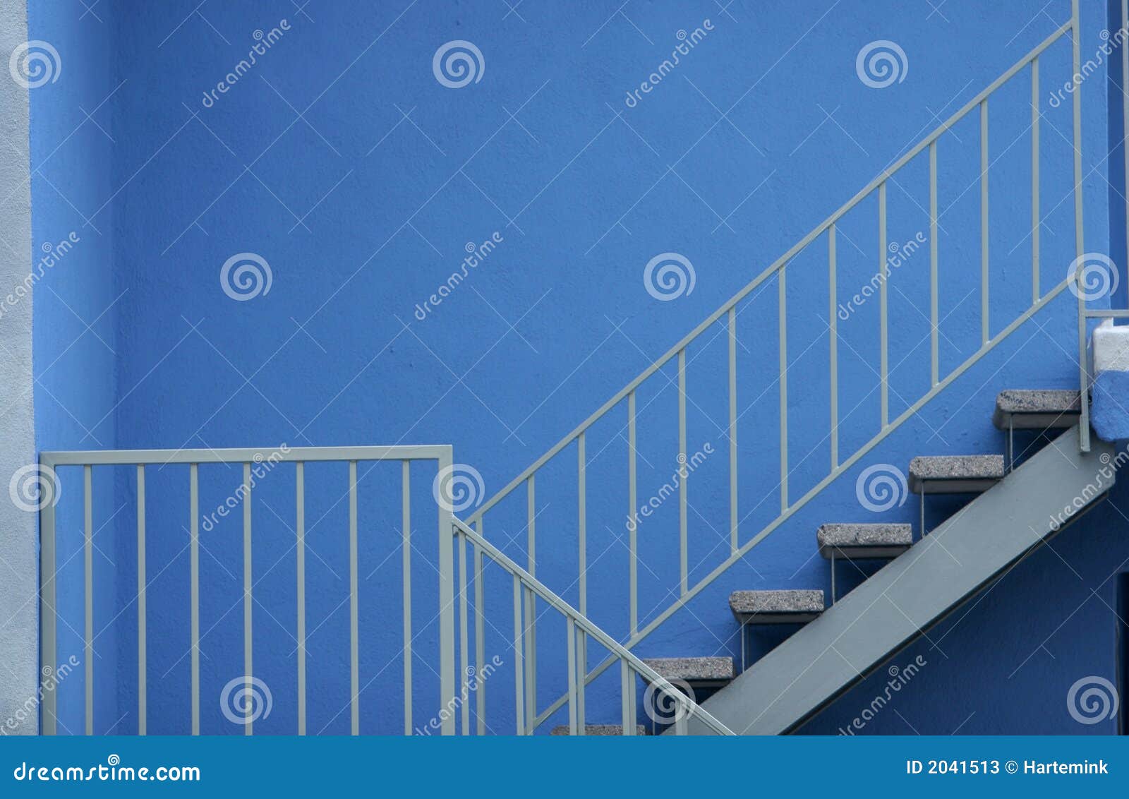Stairs with Safety Railing Against Blue Wall Stock Image Image of