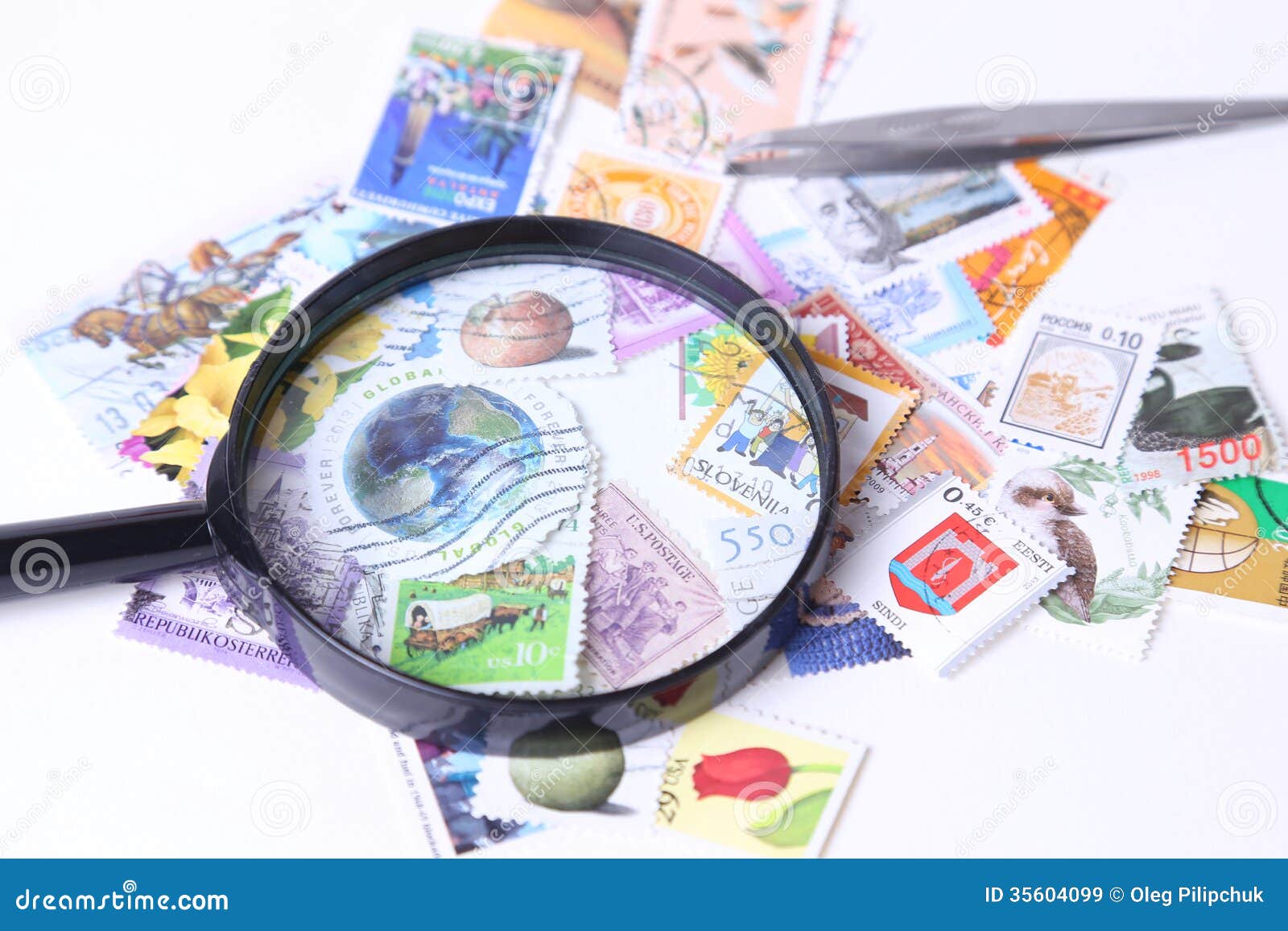 Stamp under magnifier editorial stock image. Image of philately 35604099