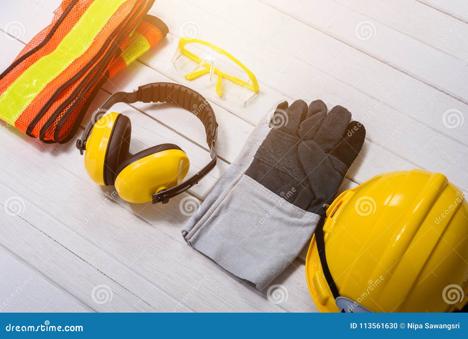 standard construction safety equipment on wooden table