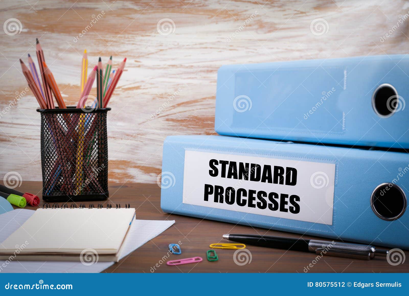 standard processes, office binder on wooden desk. on the table c