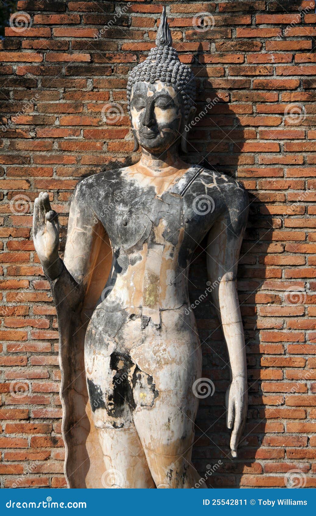 standing buddha statue at sukhothai