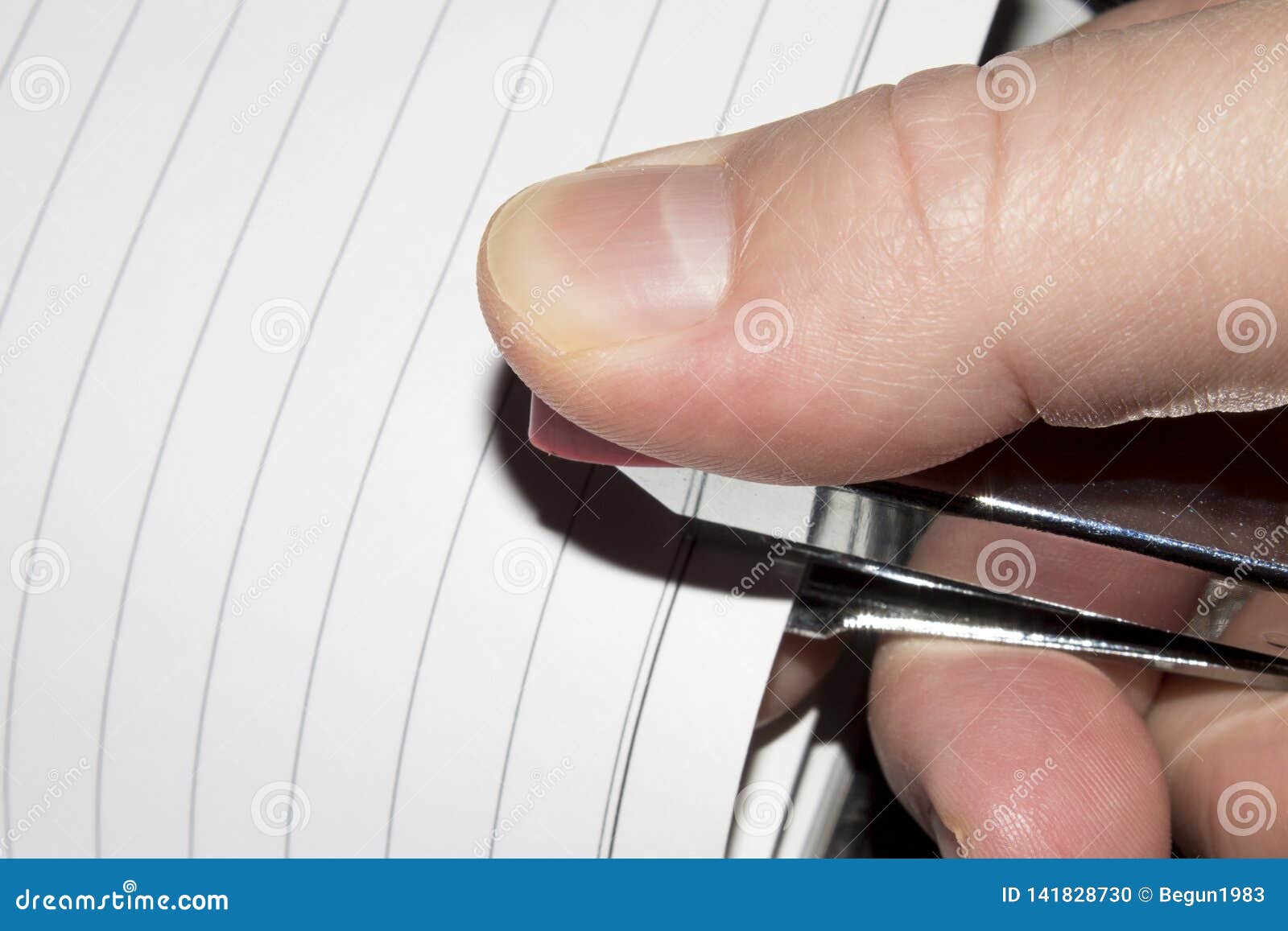 Stapler in Hand.Stapling Paper with Staples. Stock Photo Image of