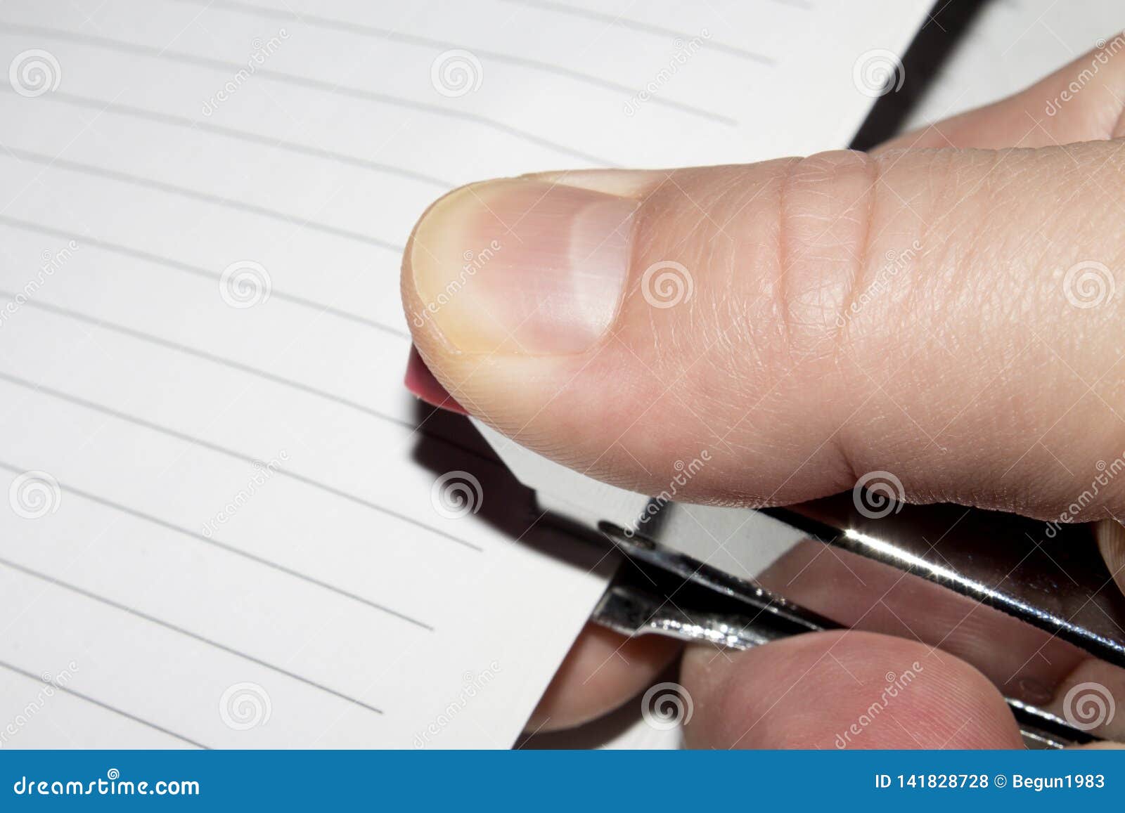 Stapler in Hand.Stapling Paper with Staples. Stock Photo Image of