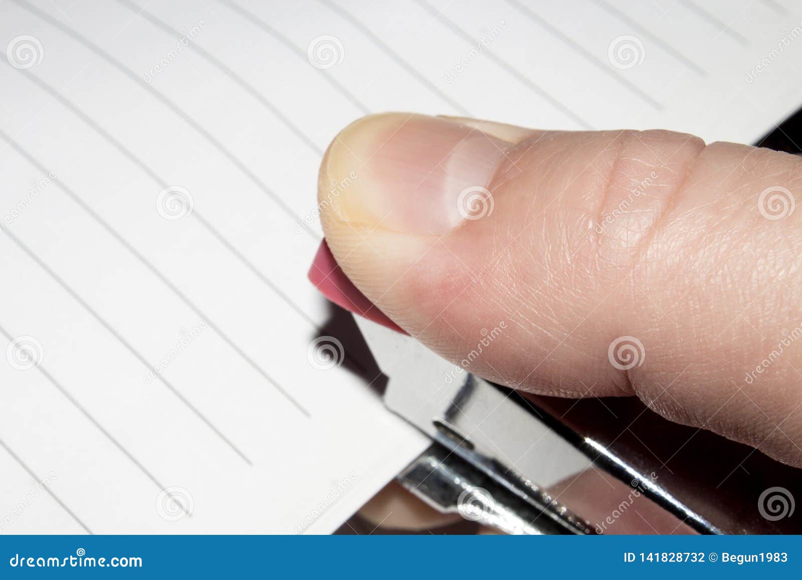 Stapler in Hand.Stapling Paper with Staples. Stock Photo Image of