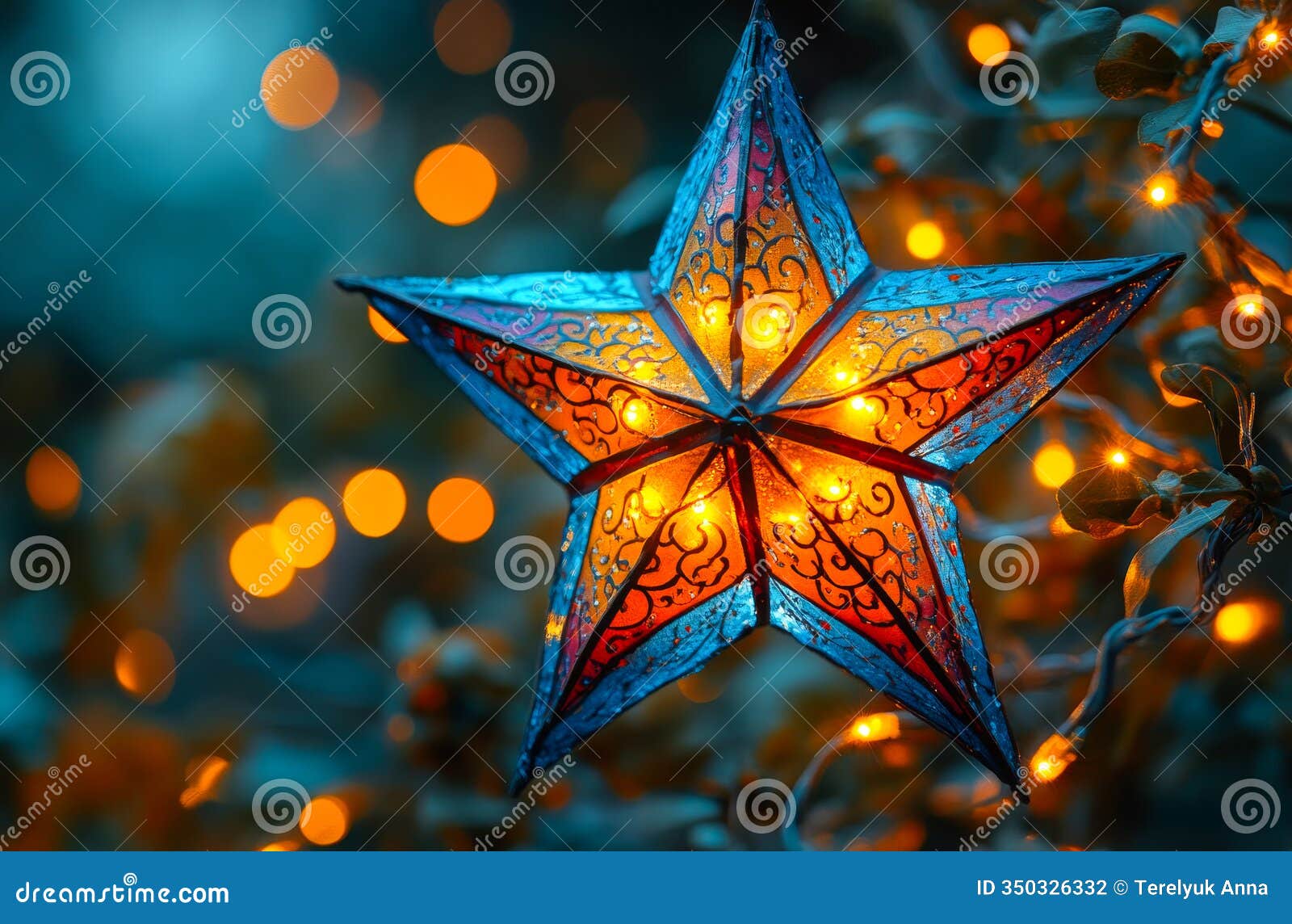 a star with lights shining on it is lit up in a blue and orange background