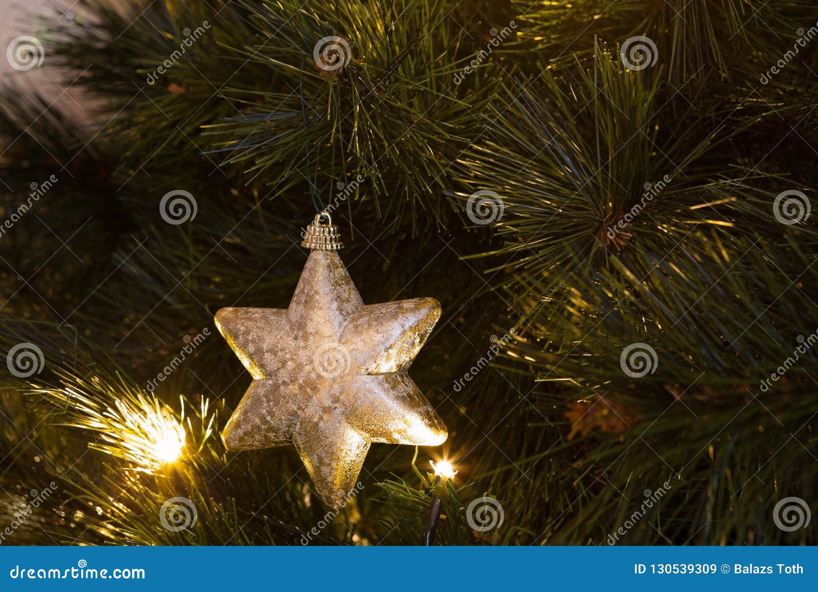 Star Ornament on Christmas Tree Stock Image - Image of lights ...