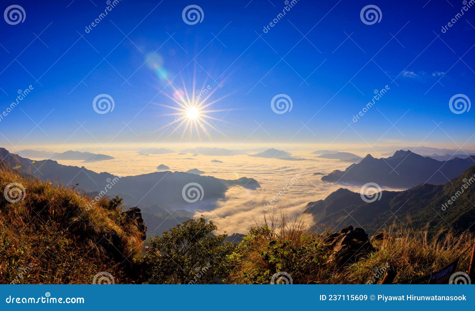 starlight sunrise scene with the peak of mountain called phu chifa with fog over the city below