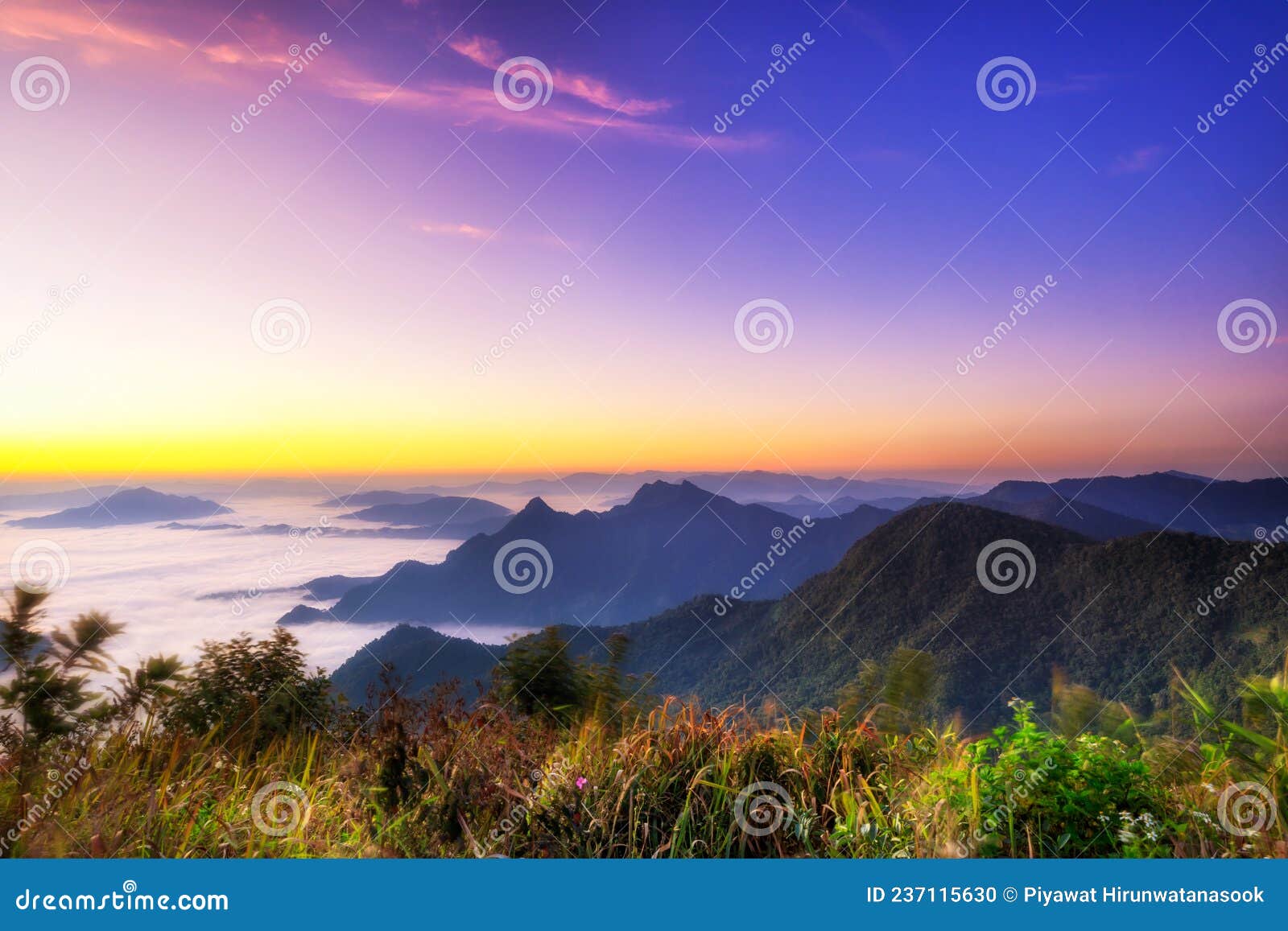 starlight sunrise scene with the peak of mountain called phu chifa with fog over the city below