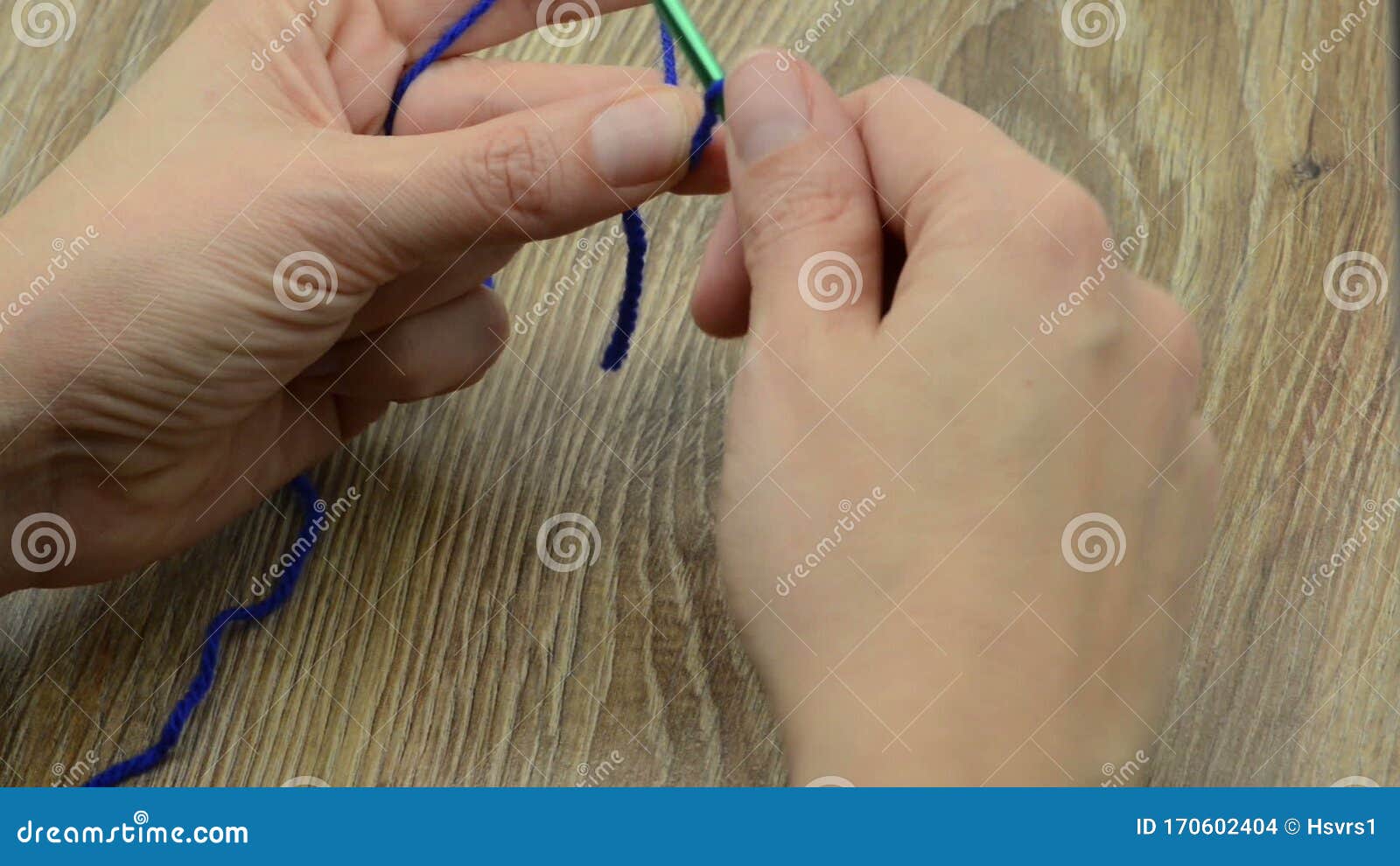 Start Crocheting Chain Stitch. Crochet Hook and Deep Blue Wool Stock