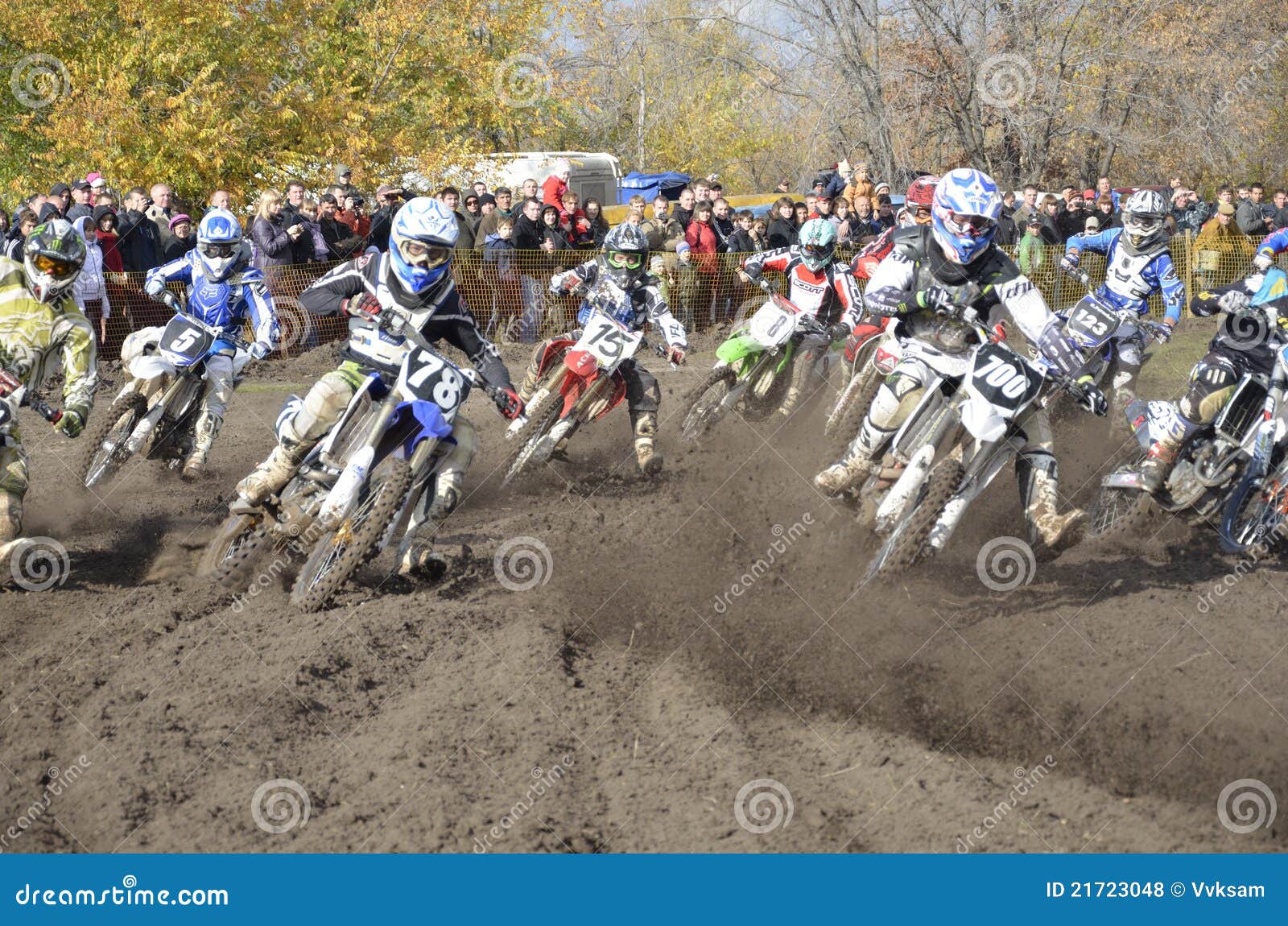Start motocross, a group of motorbike racing. RUSSIA, SAMARA, CHAPAYEVSK - OCTOBER 17: Start, a group of motorbike racing in the MX2 class competition in the first corner the Open Cup Volga motocross on October 17, 2011 in Chapayevsk, Samara, Russia