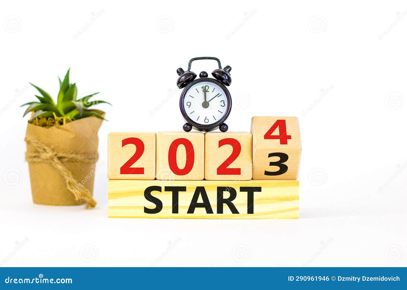 2024 Start New Year Symbol. Businessman Turns a Wooden Cube and Changes