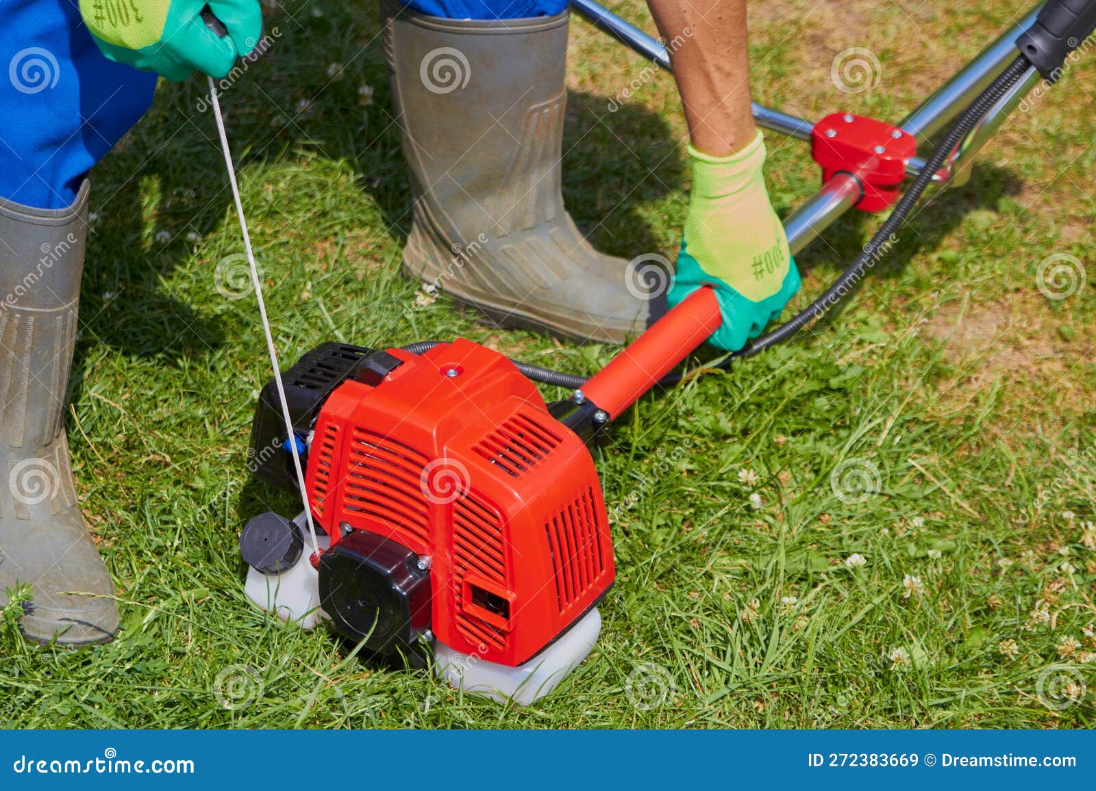 Starting a Brushcutter, Man Pulls the Cord To Start the Brush Cutter Stock Image Image of