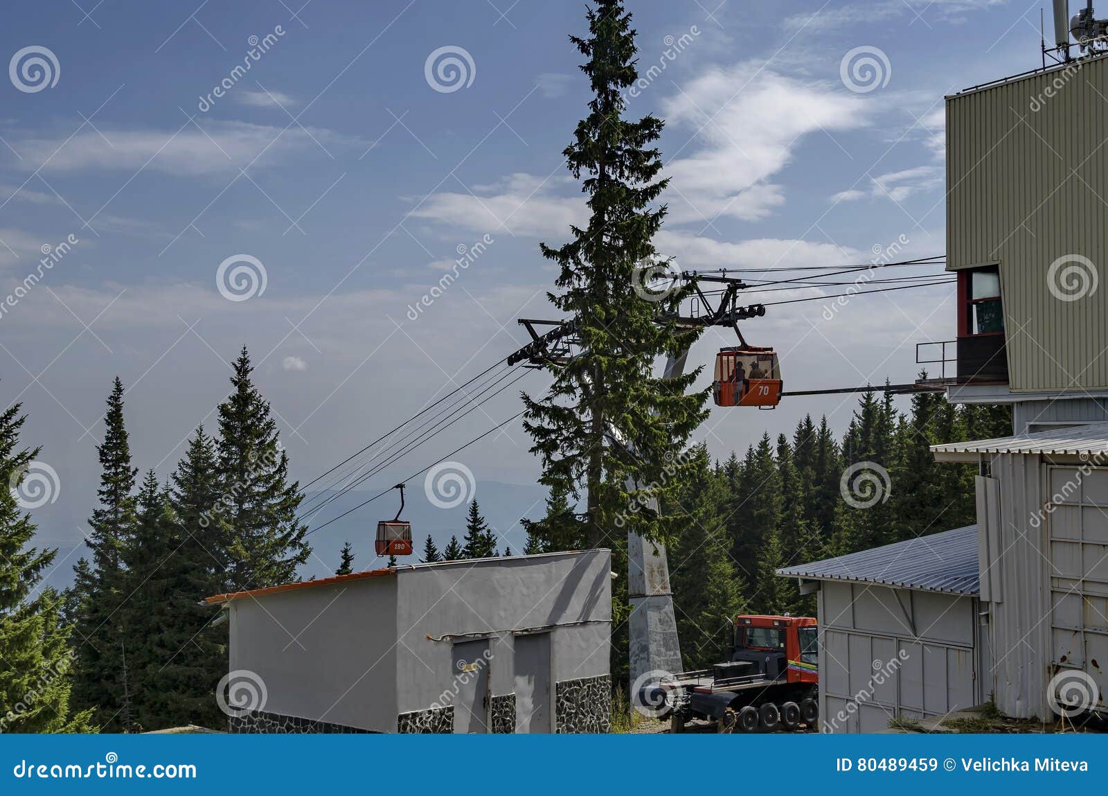 station of contemporary ski tow or lift in sunny day with blue sky near by hija or rest-house aleko, cherni vrah